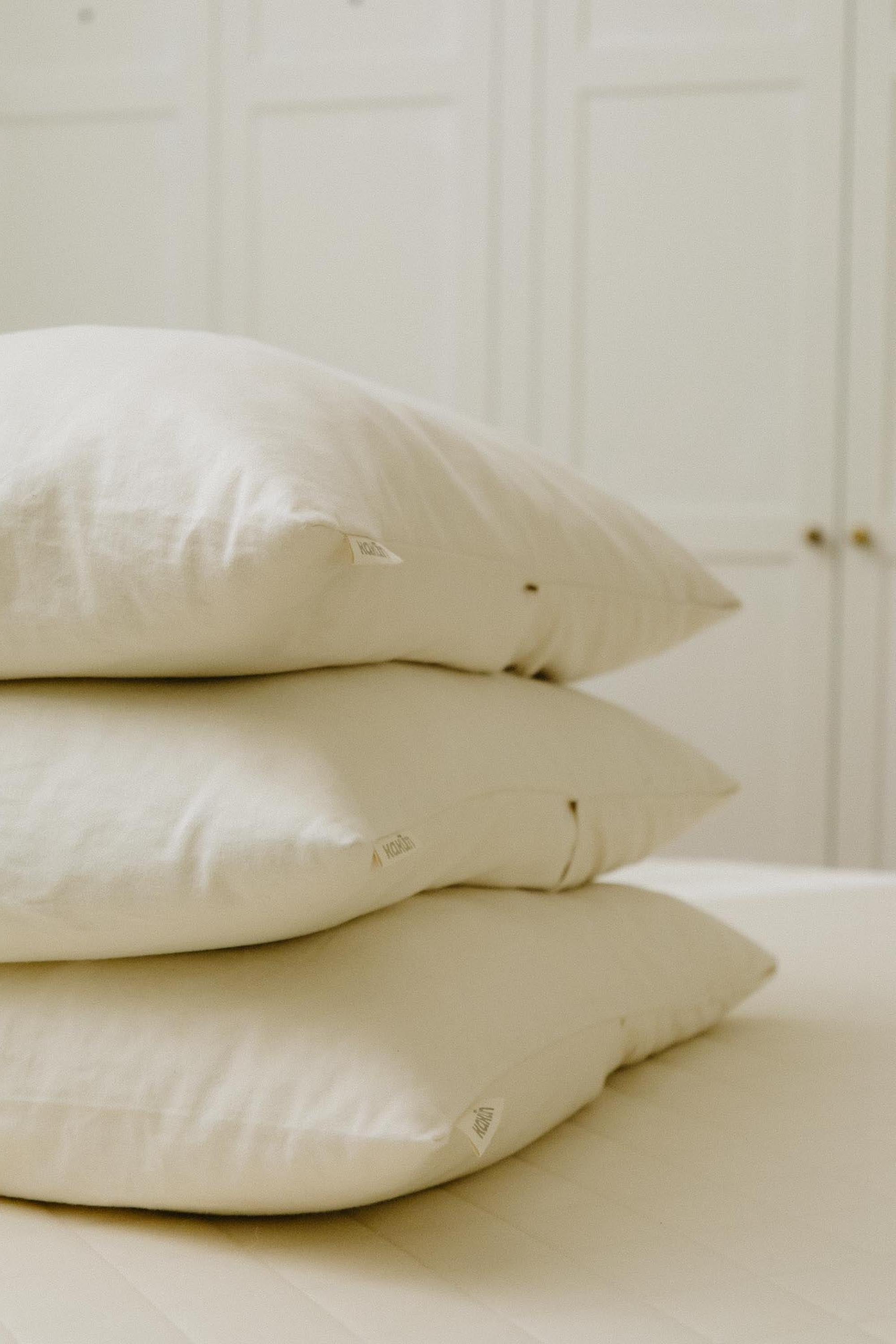 Organic pillow collection from Resthouse. Organic head pillows and travel pillows made from natural eco wool, shredded latex, and organic wool.