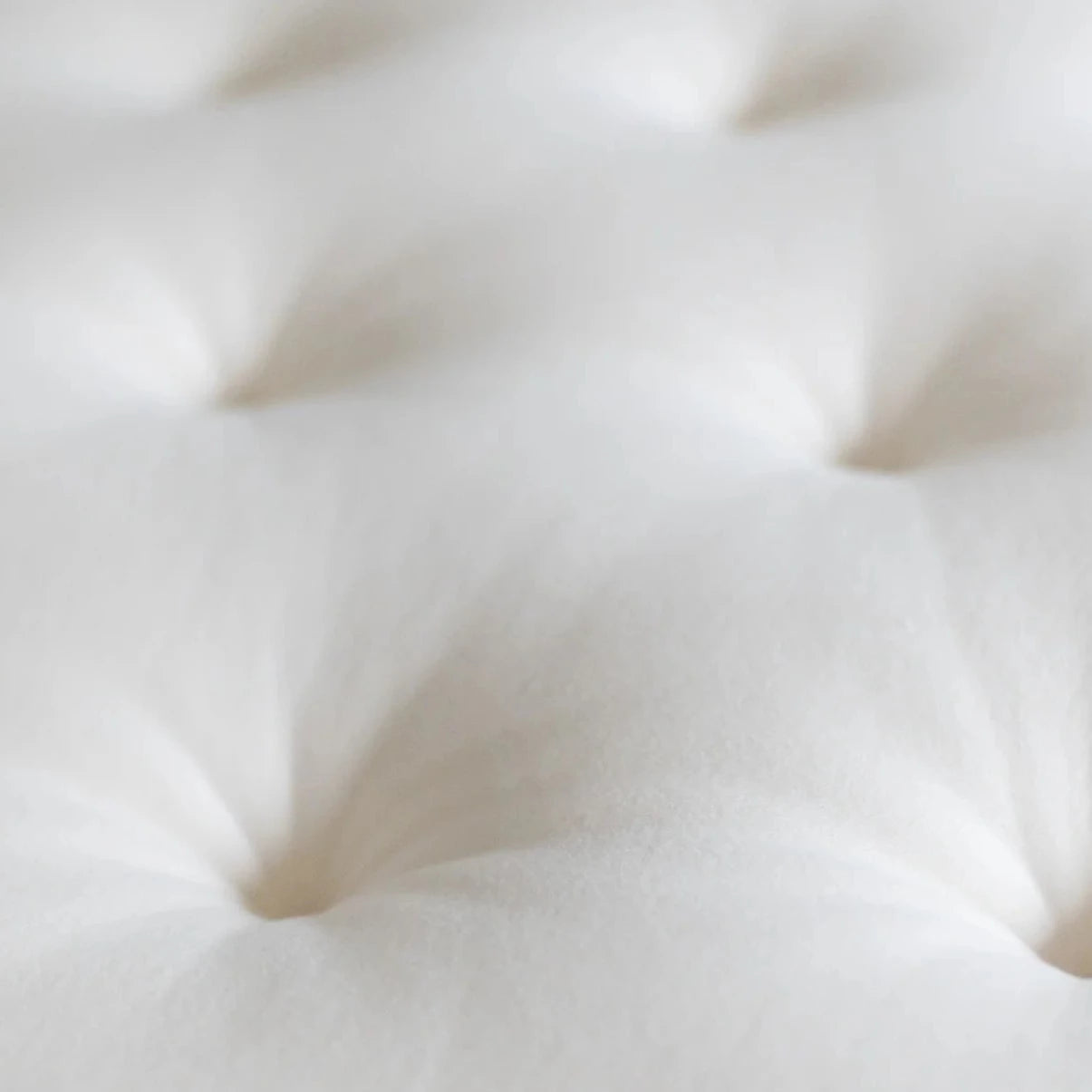 Natural, all-wool topper with organic cotton casing