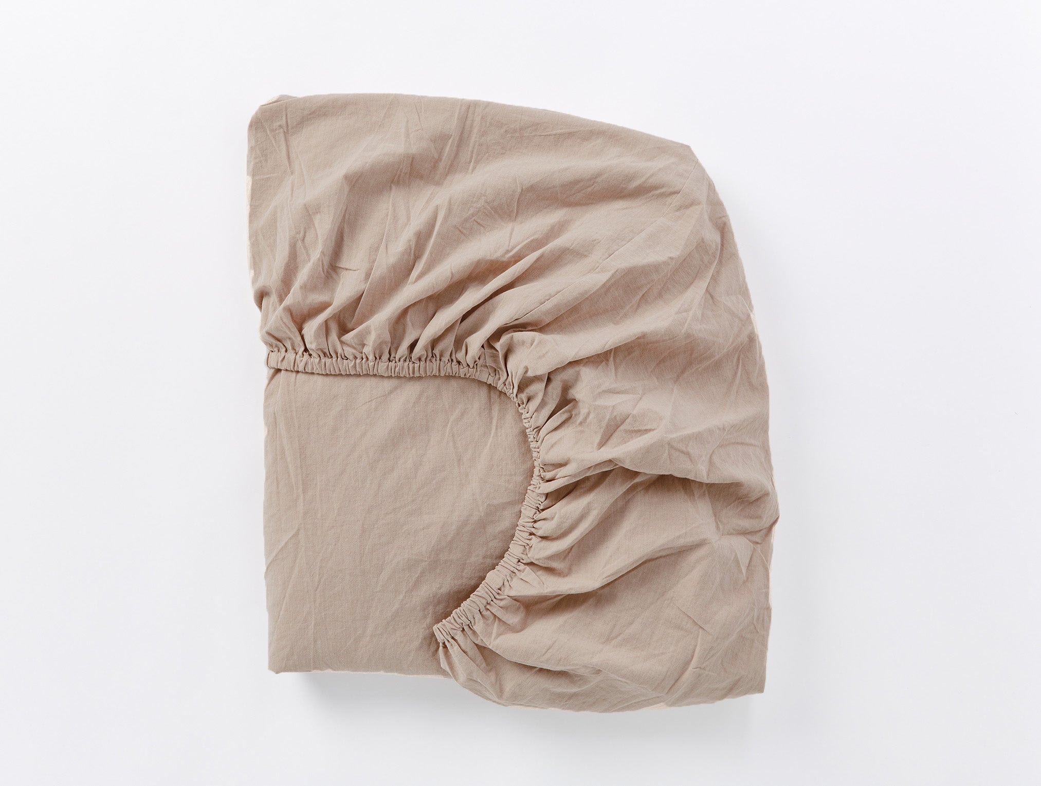Coyuchi Organic Crinkled Percale Fitted Sheet in Hazel Chambray – folded to display elastic in seam. #colour_hazel chambray