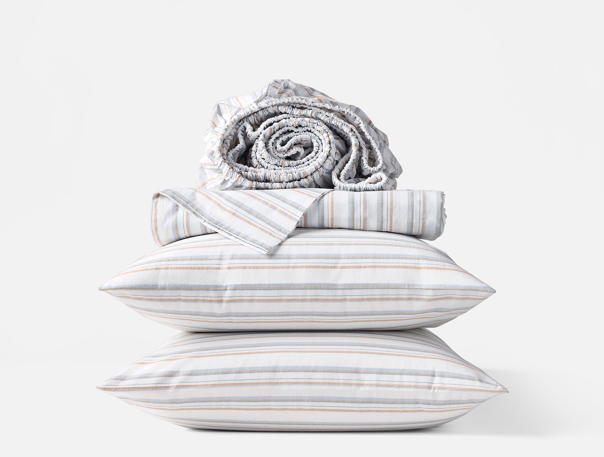 Coyuchi Organic Crinkled Percale Sheet Set in Surf Stripe – stacked display with pillows and folded sheets. #colour_surf-stripe