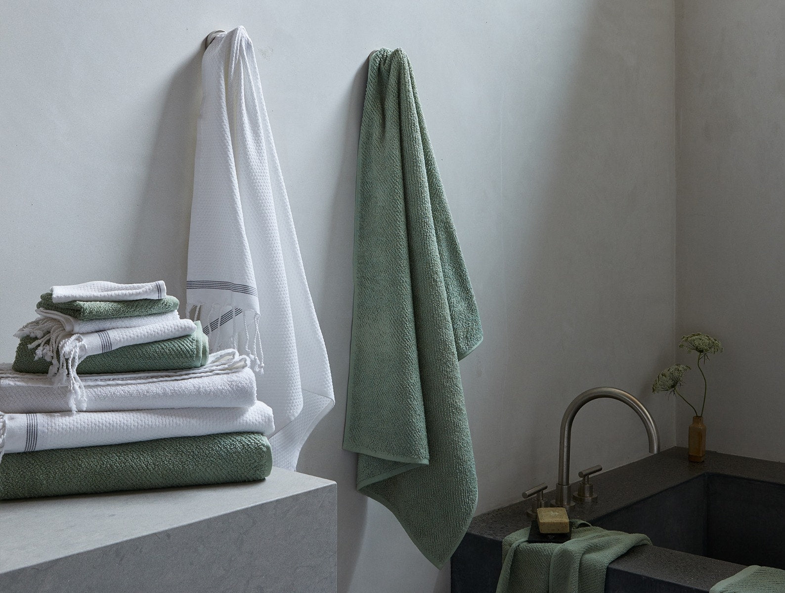 Coyuchi Organic Air Weight Towel - hanging next to bathtub #color_sage