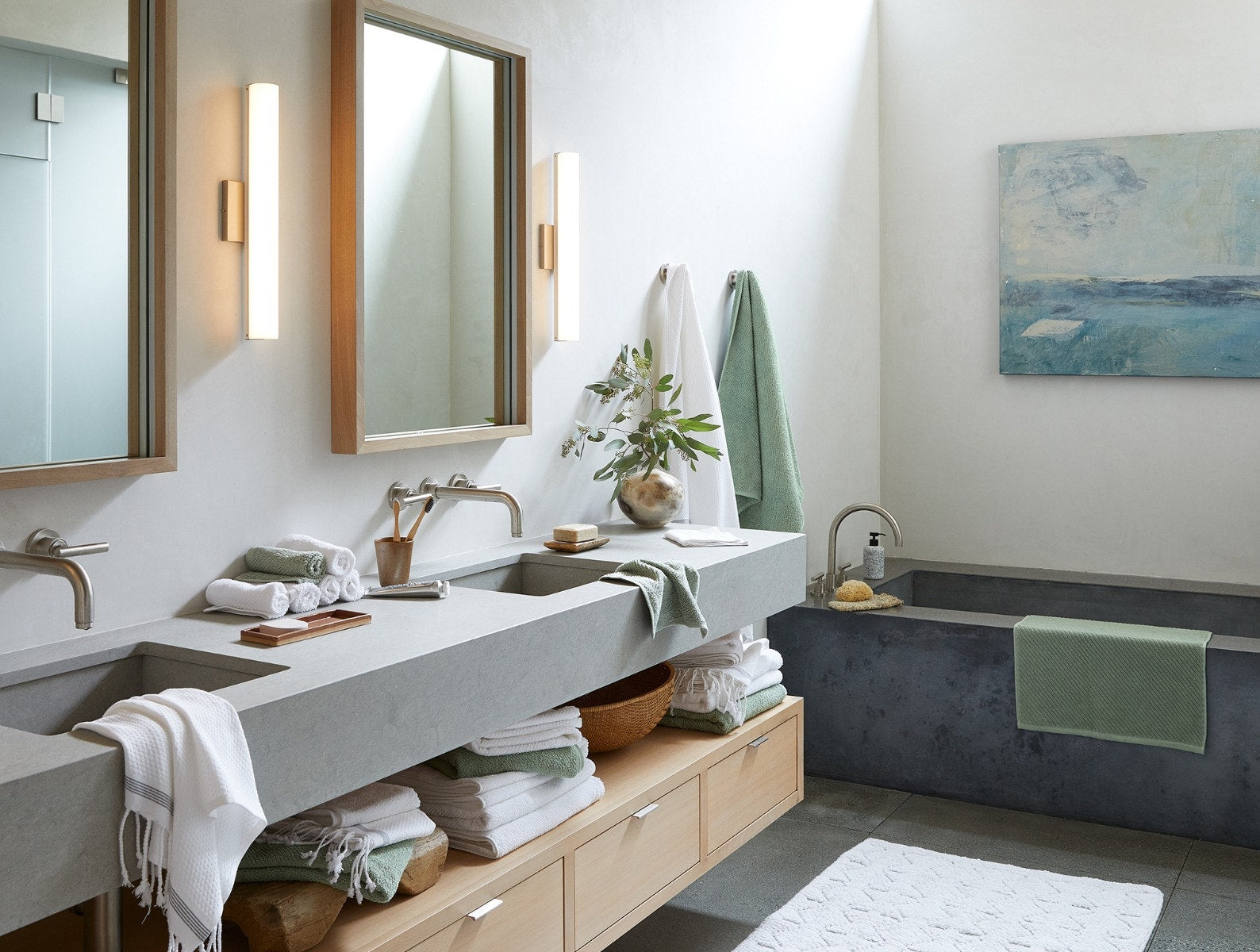 Coyuchi Organic Air Weight Towel - hanging on wall and draped over tub #color_sage