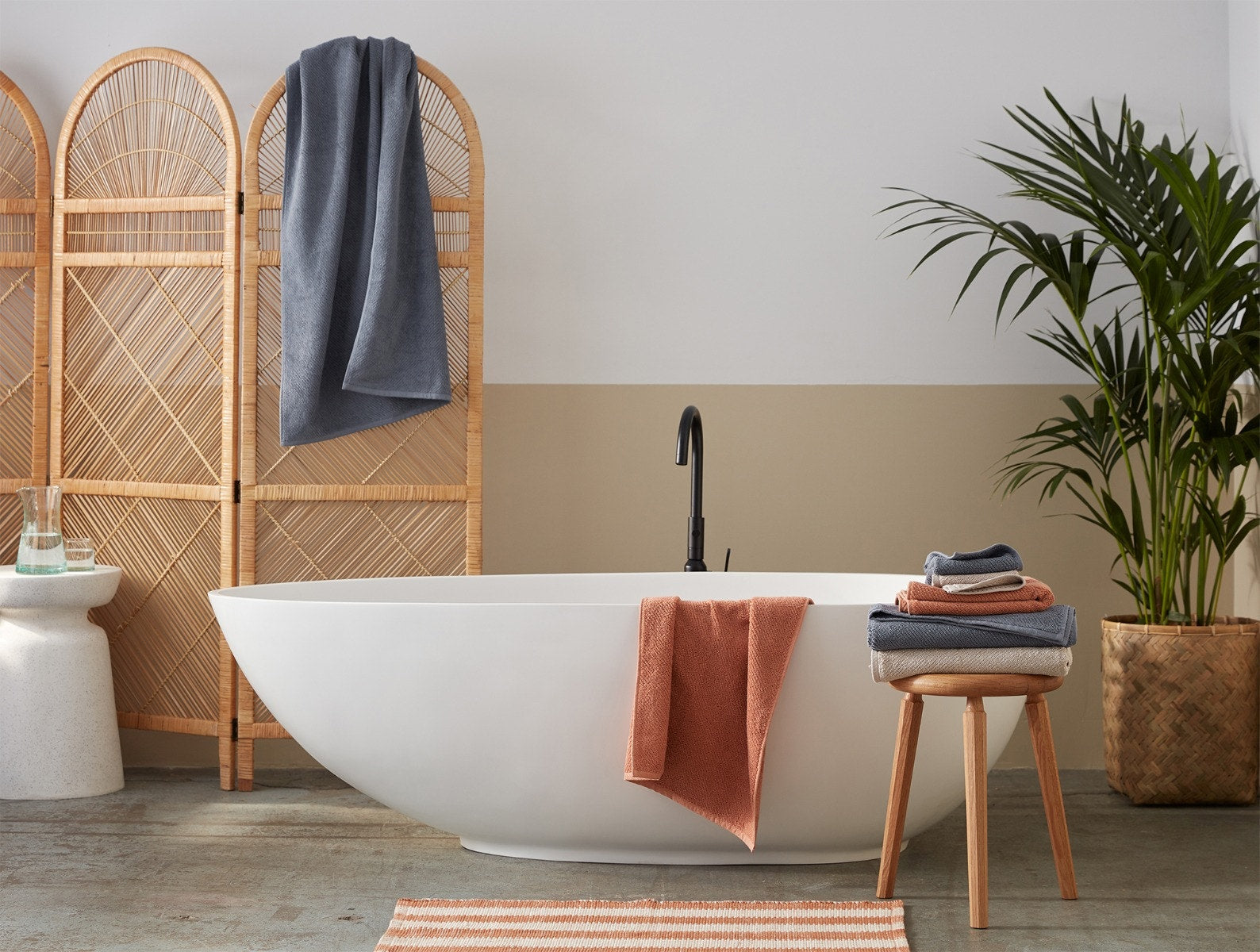 Coyuchi Organic Air Weight Towel - draped over bathtub #color_sedona