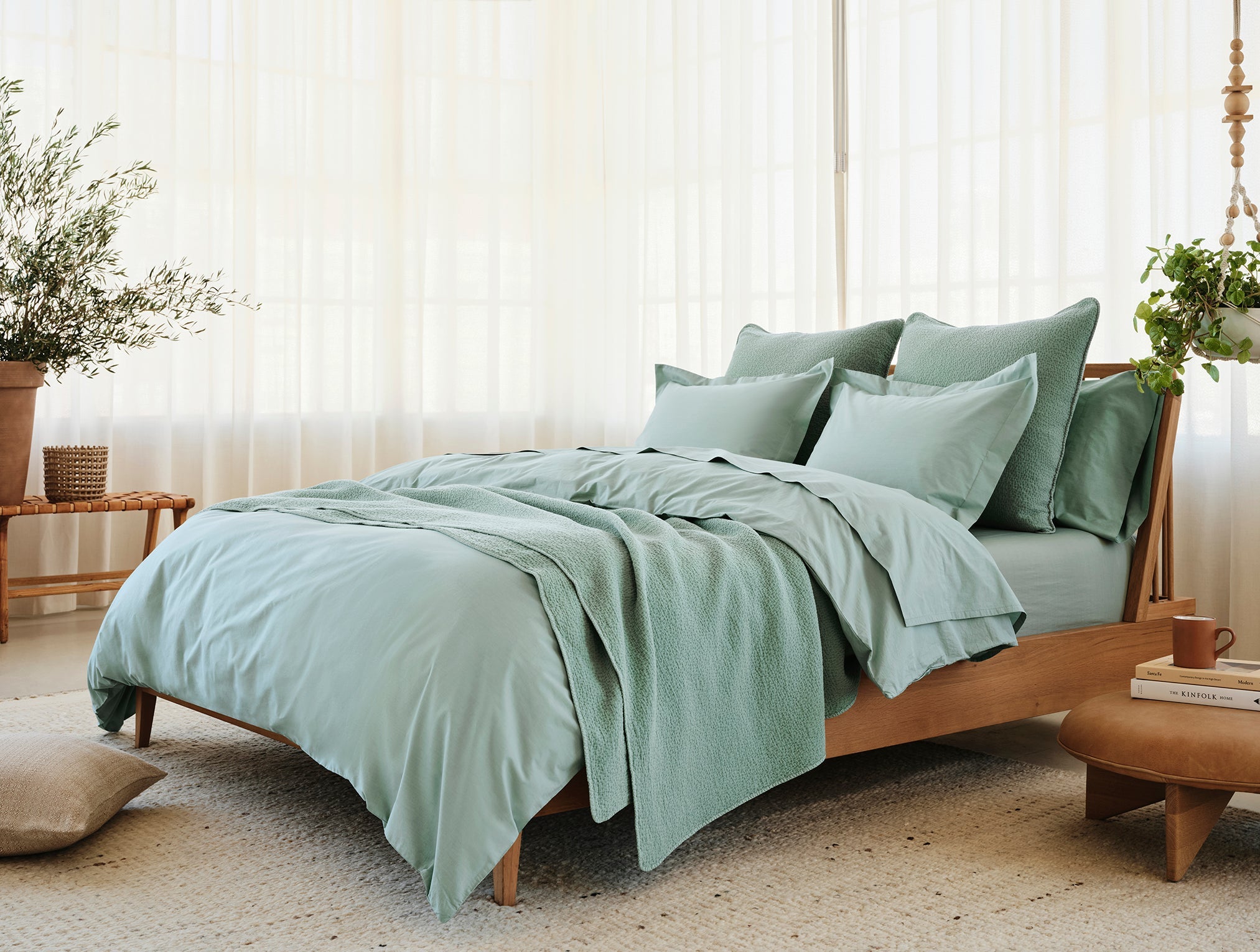 Coyuchi Organic Cascade Matelasse Blanket - staged bed wood frame matching sheets #colour_Seafoam