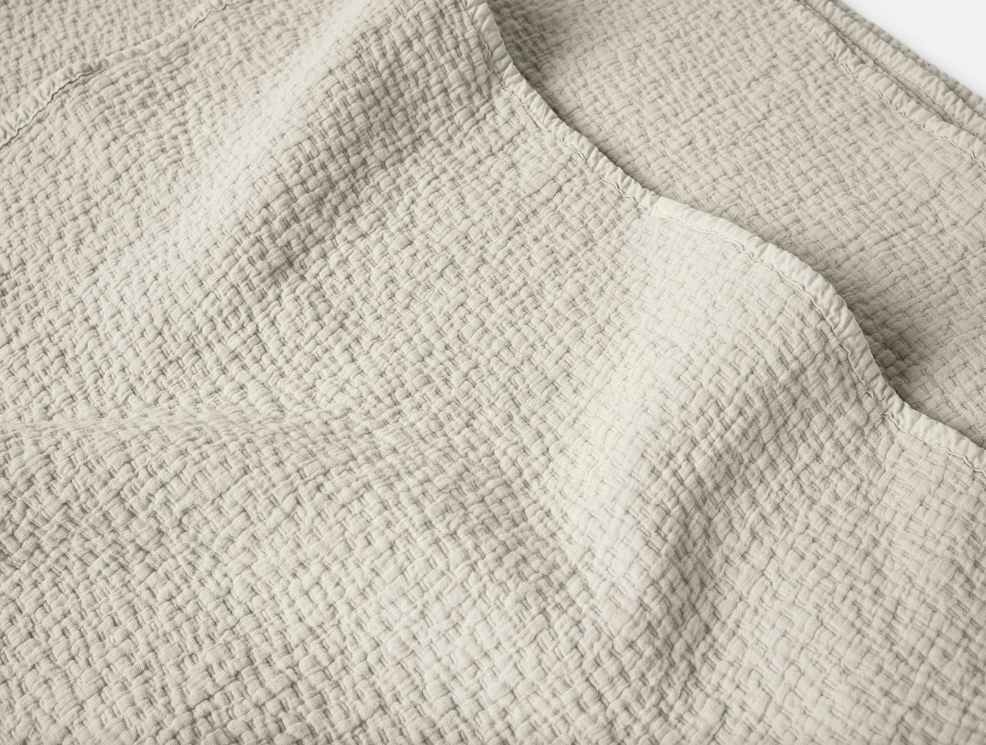 Coyuchi Organic Cascade Matelasse Blanket - close up texture #colour_Stone