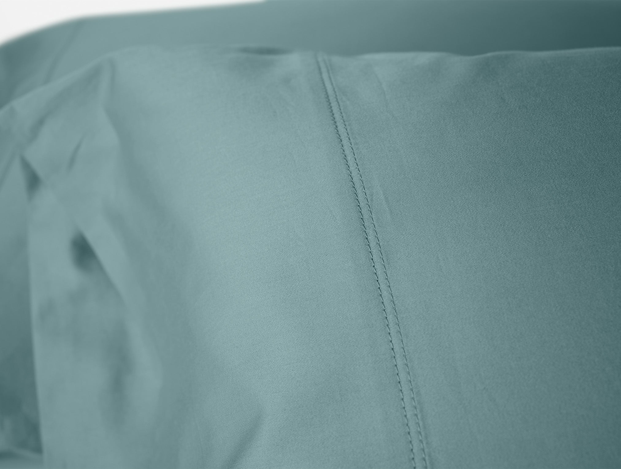 Coyuchi Organic Cloud Soft Sateen Pillowcase - close up of stitching #colour_pacific blue