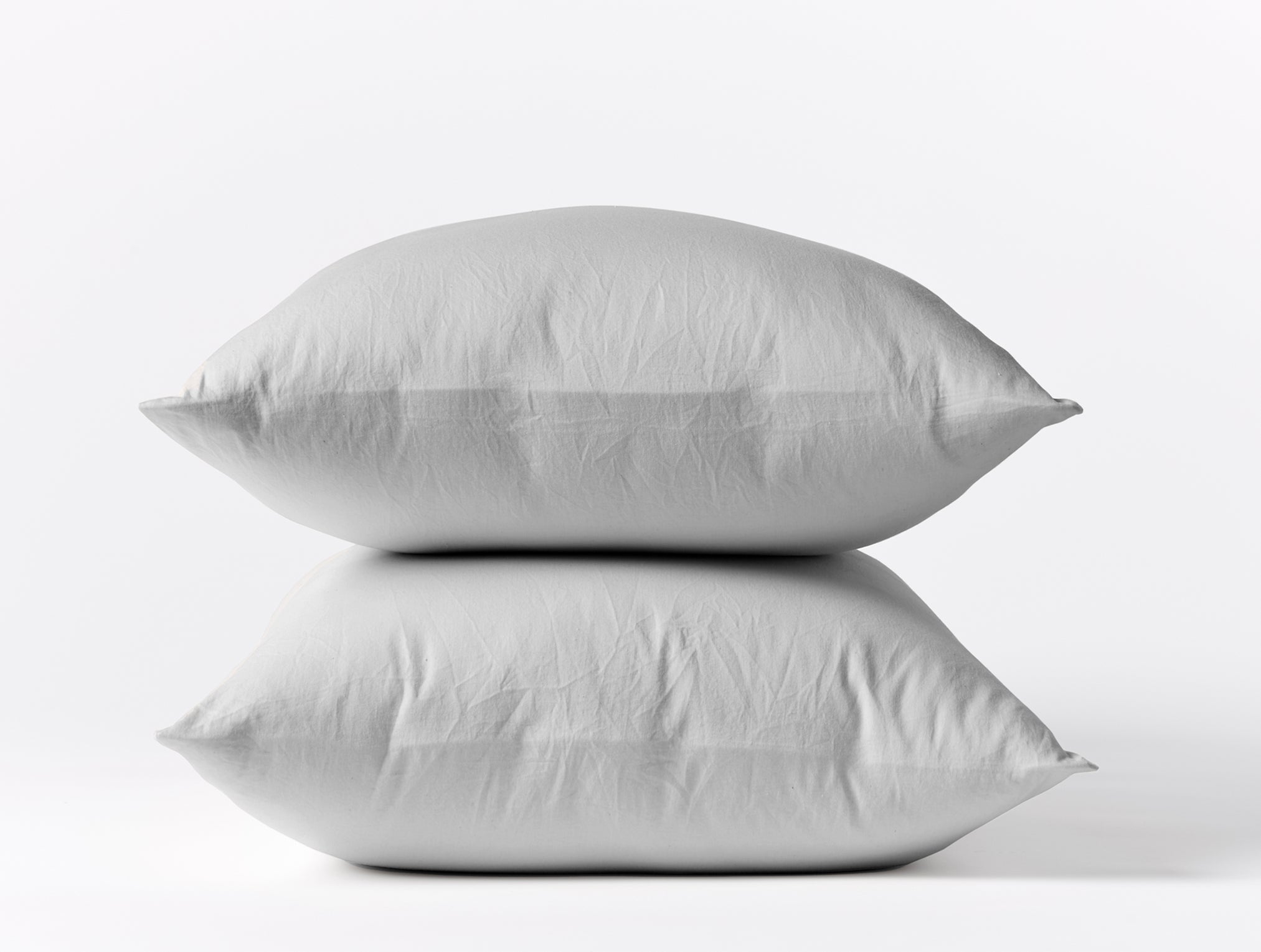 Coyuchi Organic Cloud Soft Sateen Pillowcase - stacked pillows #colour_pale grey