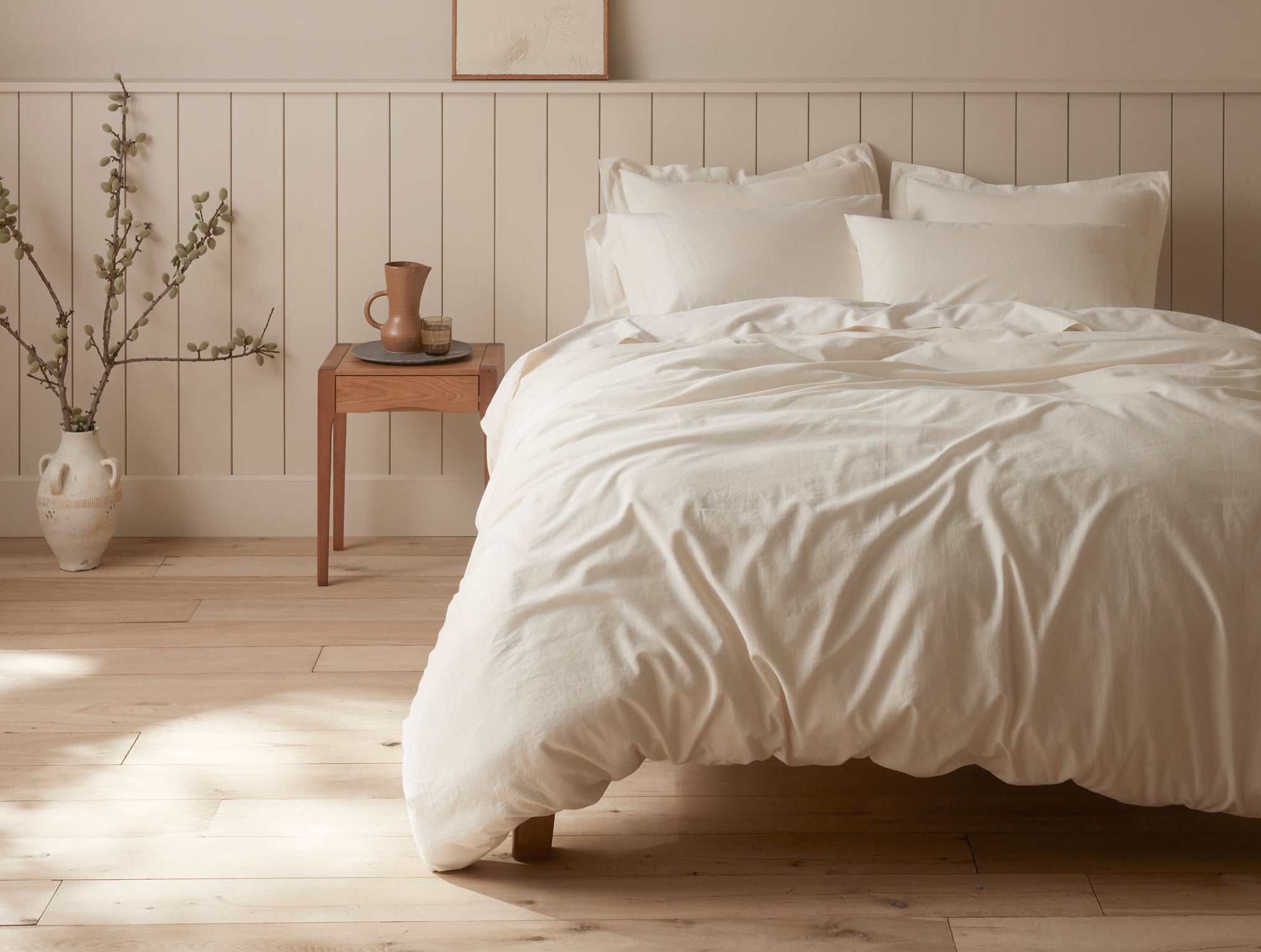 Coyuchi Organic Cloud Soft Sateen Pillowcase - staged bedroom soft light from window #colour_undyed