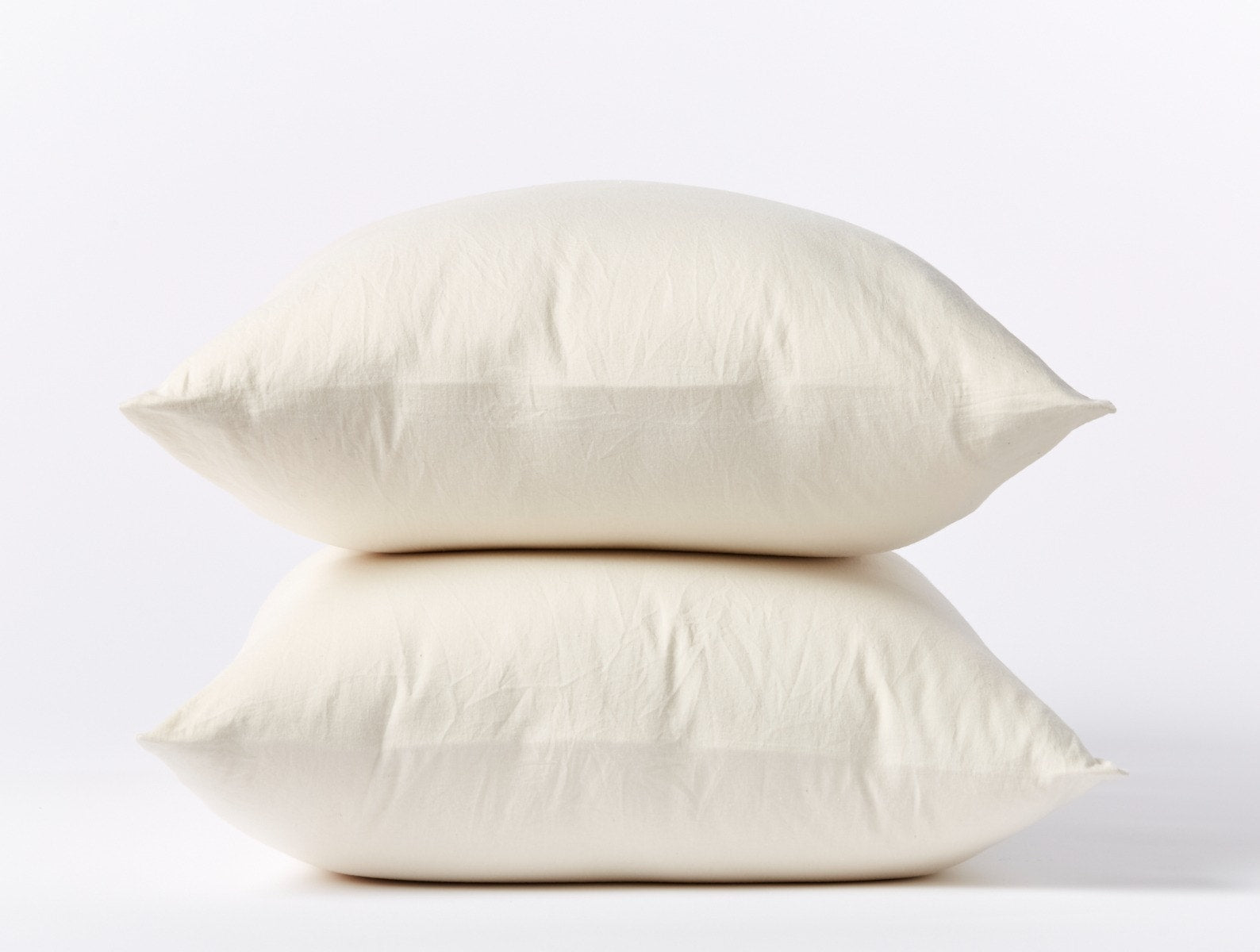 Coyuchi Organic Cloud Soft Sateen Pillowcase - stacked pillows #colour_undyed