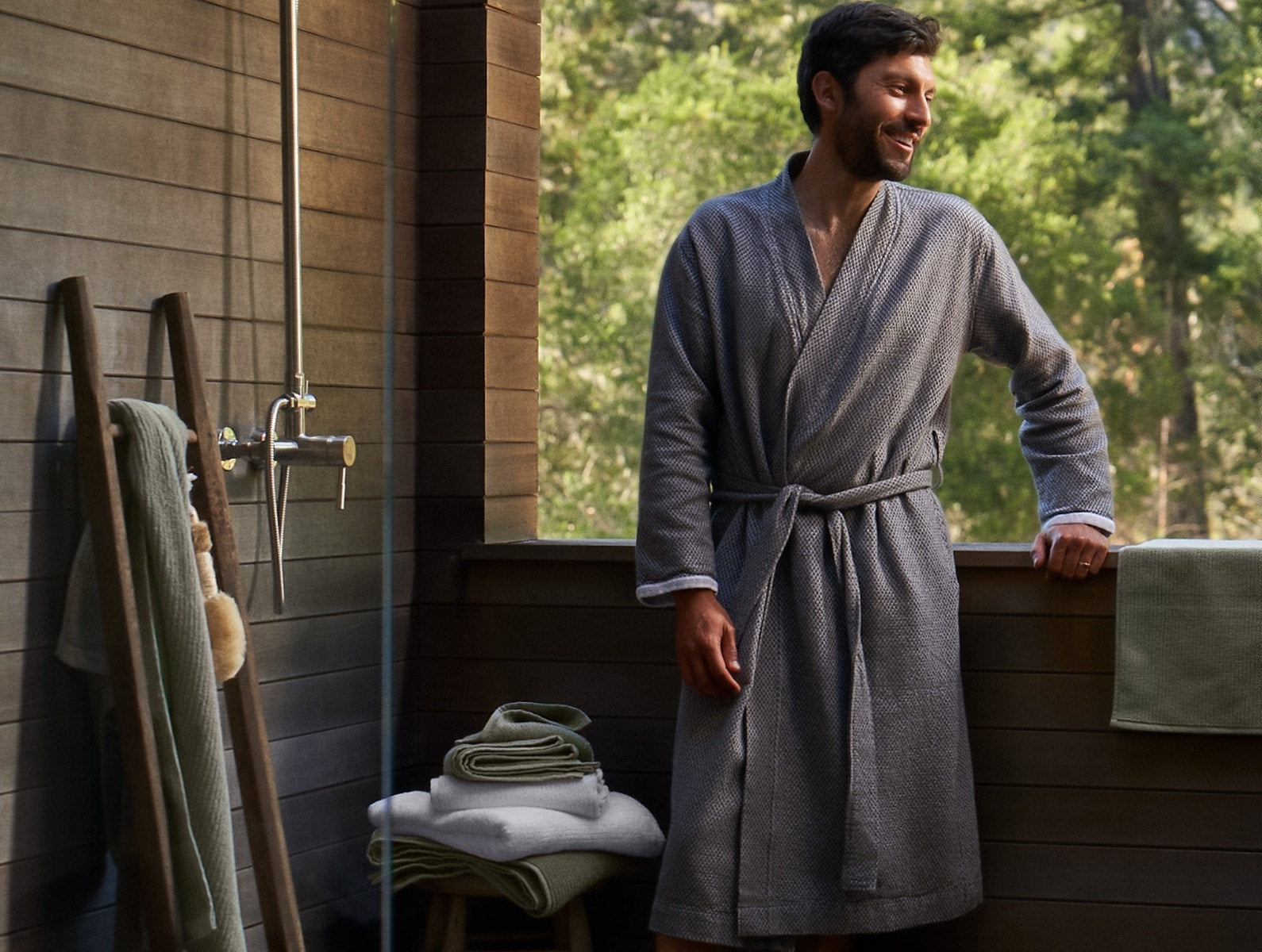 Coyuchi Organic Cotton Mediterranean Modern Robe - male model in outdoor shower #colour_shadow