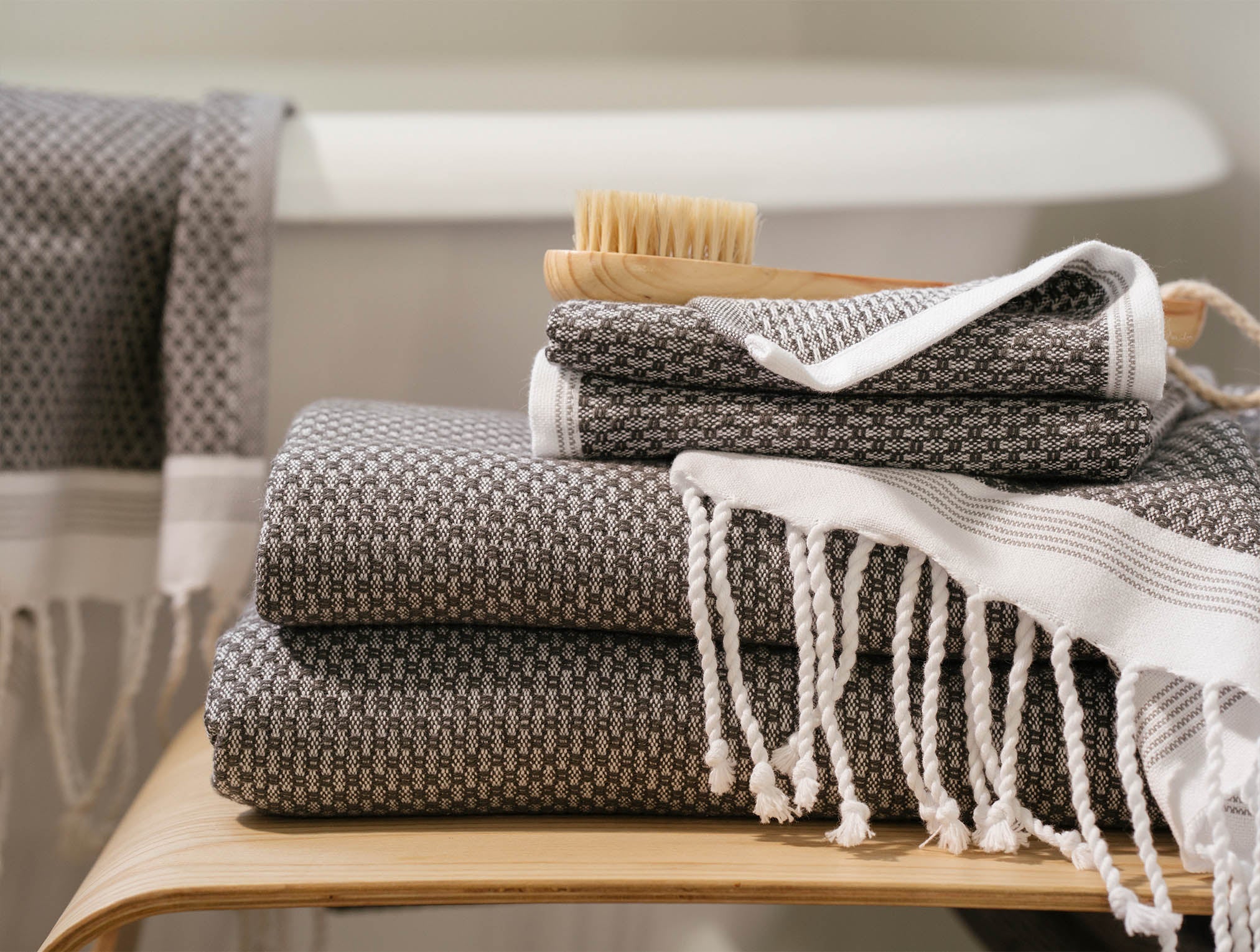 Coyuchi Organic Cotton Mediterranean Towel - 4 stacked with brush on top #colour_Shadow w/ Deep Pewter Stripes