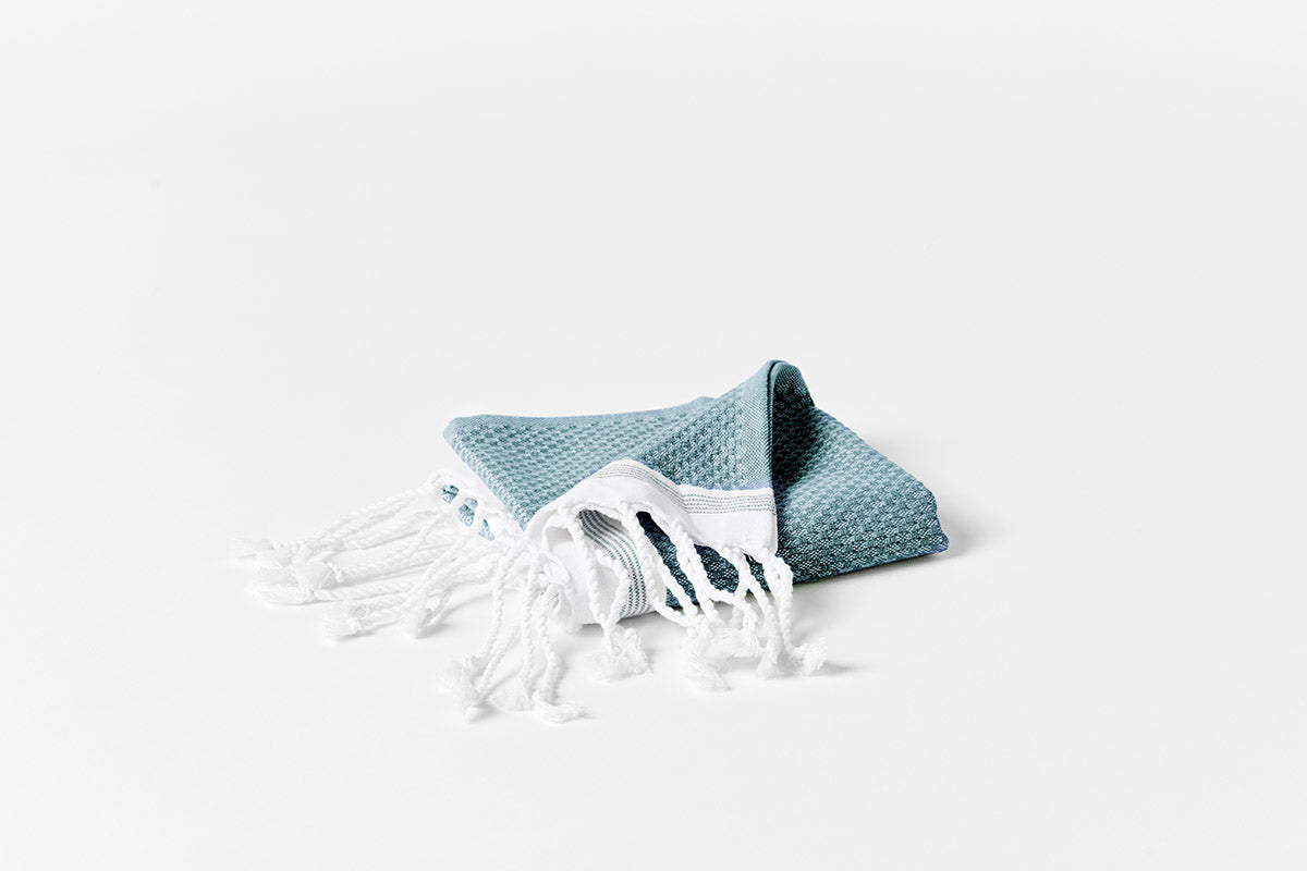 Coyuchi Organic Cotton Mediterranean Towels - hand towel corner folded #colour_Aquamarine w/Sea Spray