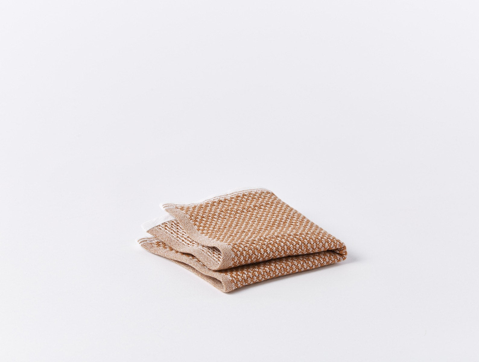Coyuchi Organic Cotton Mediterranean Wash Cloth - folded #colour_Coyuchi Cotton w/ Rust Stripes