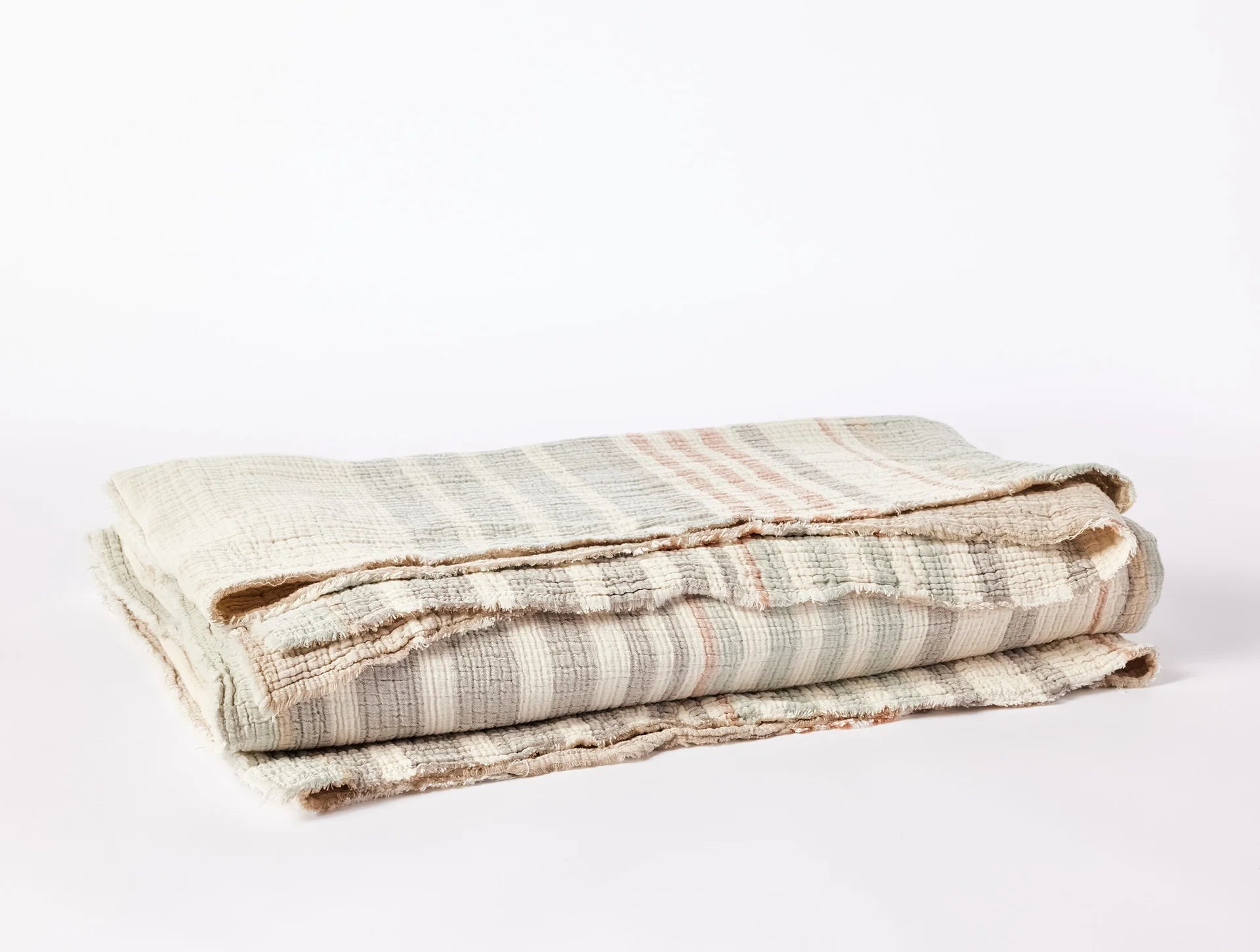 Coyuchi Topanga Organic Cotton Matelasse Blanket - folded #colour_Sunset Stripe
