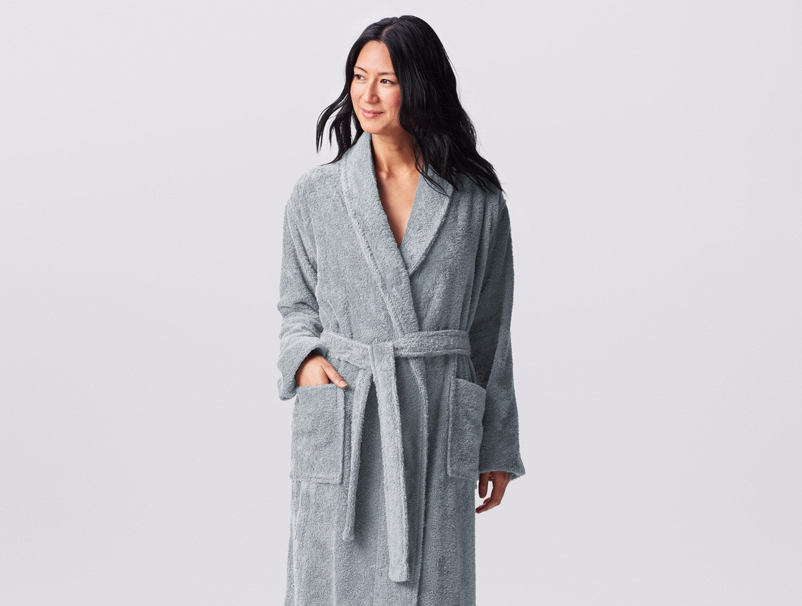 Coyuchi Organic Cotton Unisex Cloud Loom Robe - model with hand in pocket #colour_Palest Ocean