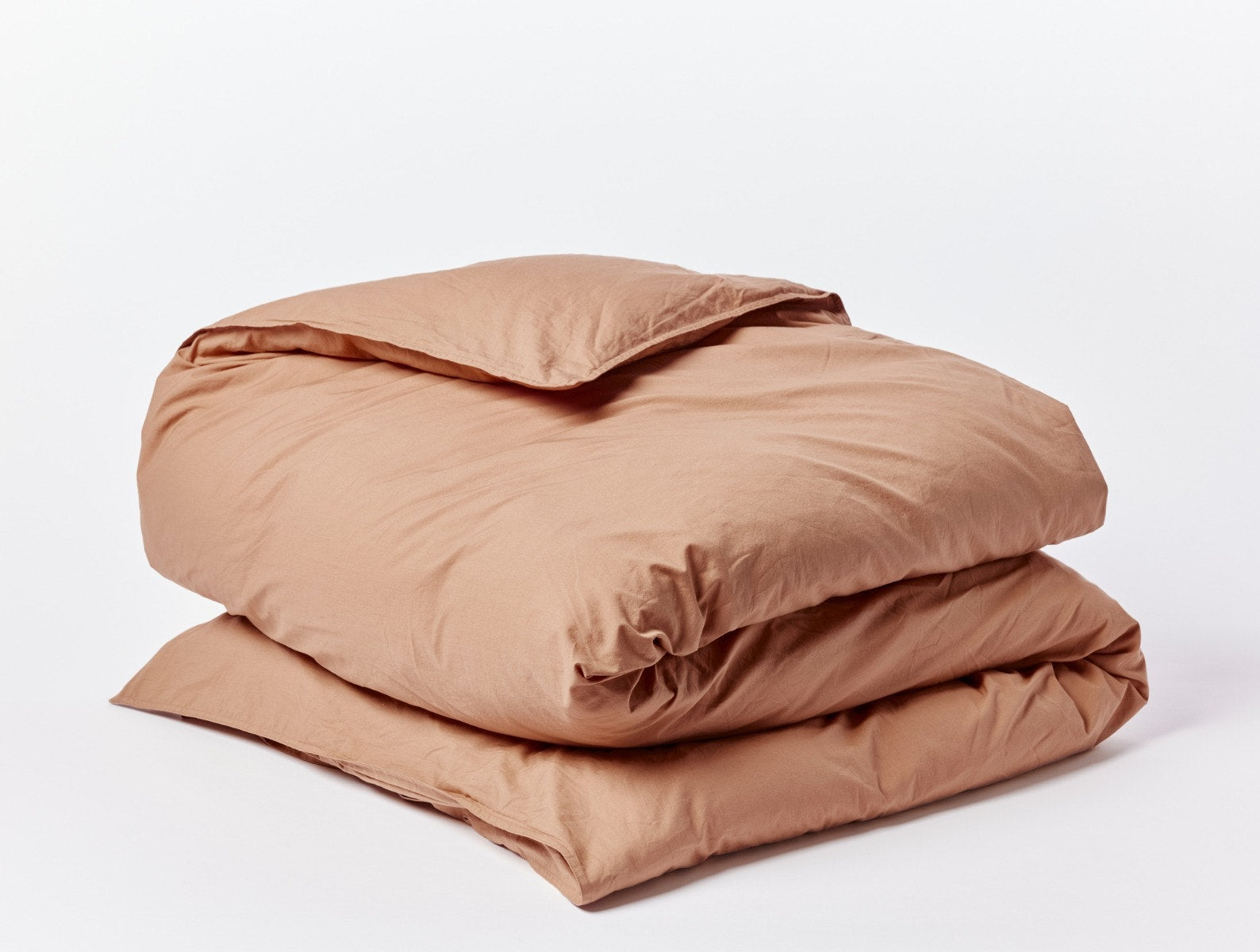 Coyuchi Organic Crinkled Percale Duvet Cover - folded #colour_Ginger