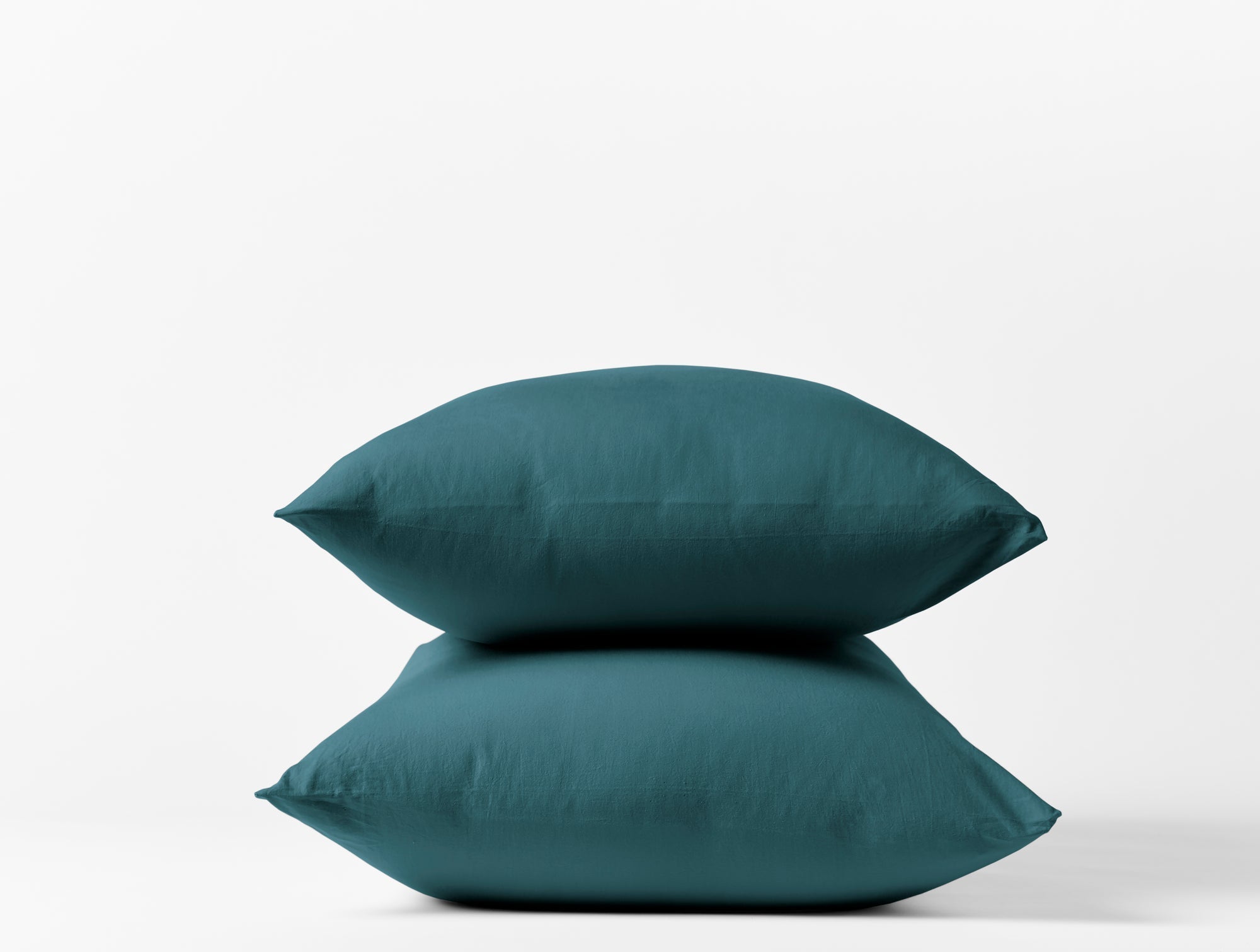 Coyuchi Organic Crinkled Percale Pillowcase - stacked with white background #colour_aegean