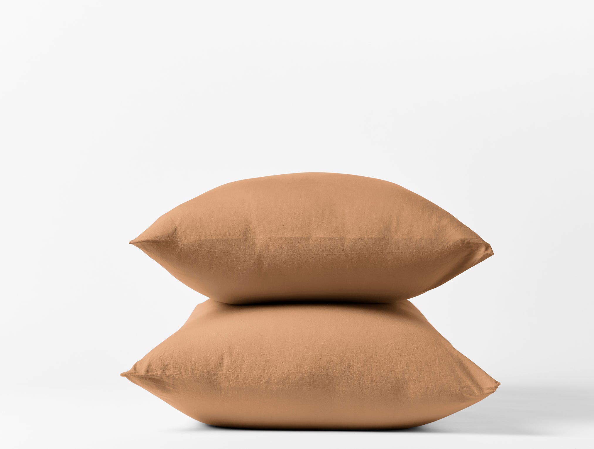 Coyuchi Organic Crinkled Percale Pillowcase - stacked on white background #colour_ginger
