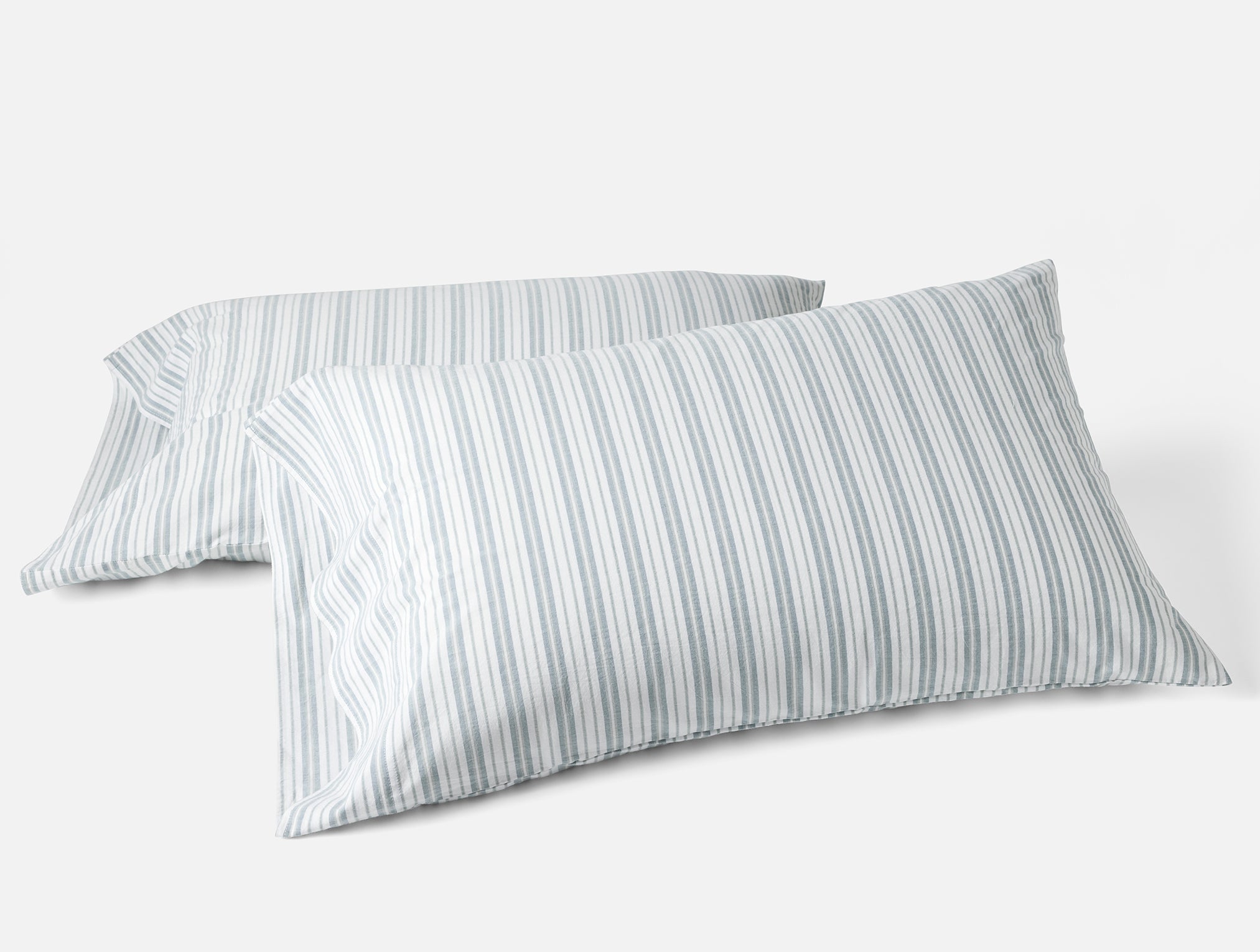 Coyuchi Organic Crinkled Percale Pillowcase - stacked askew with white background #colour_Pacific Blue Stripe