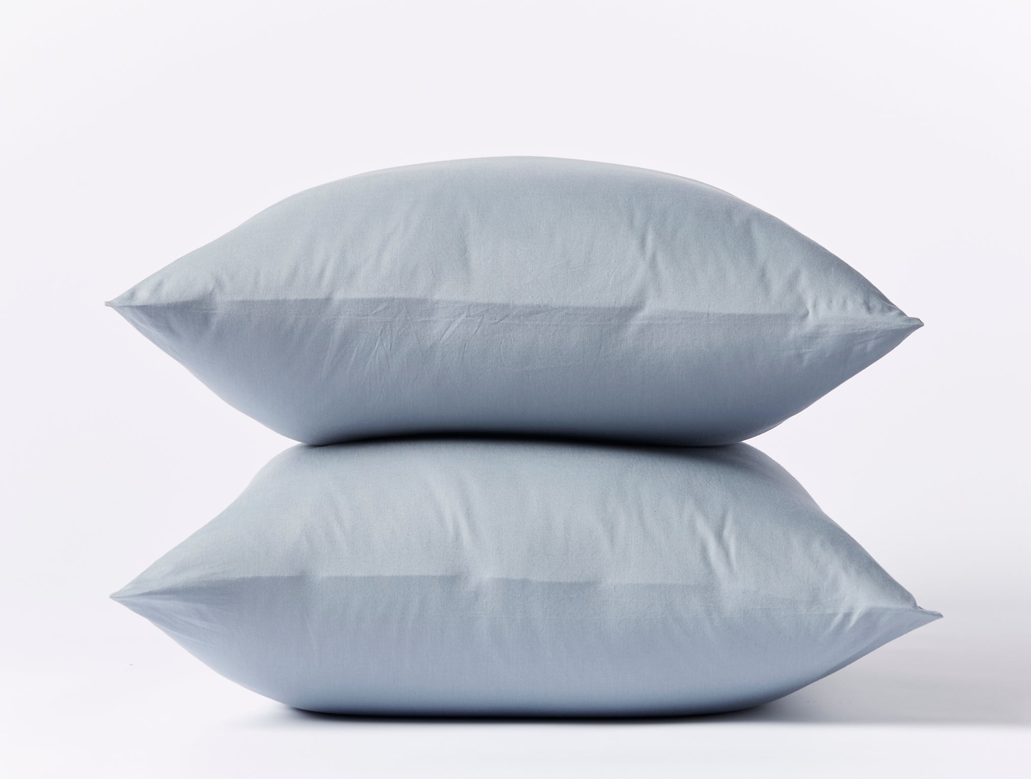 Coyuchi Crinkled Percale Pillowcase - stacked with white background #colour_steel blue