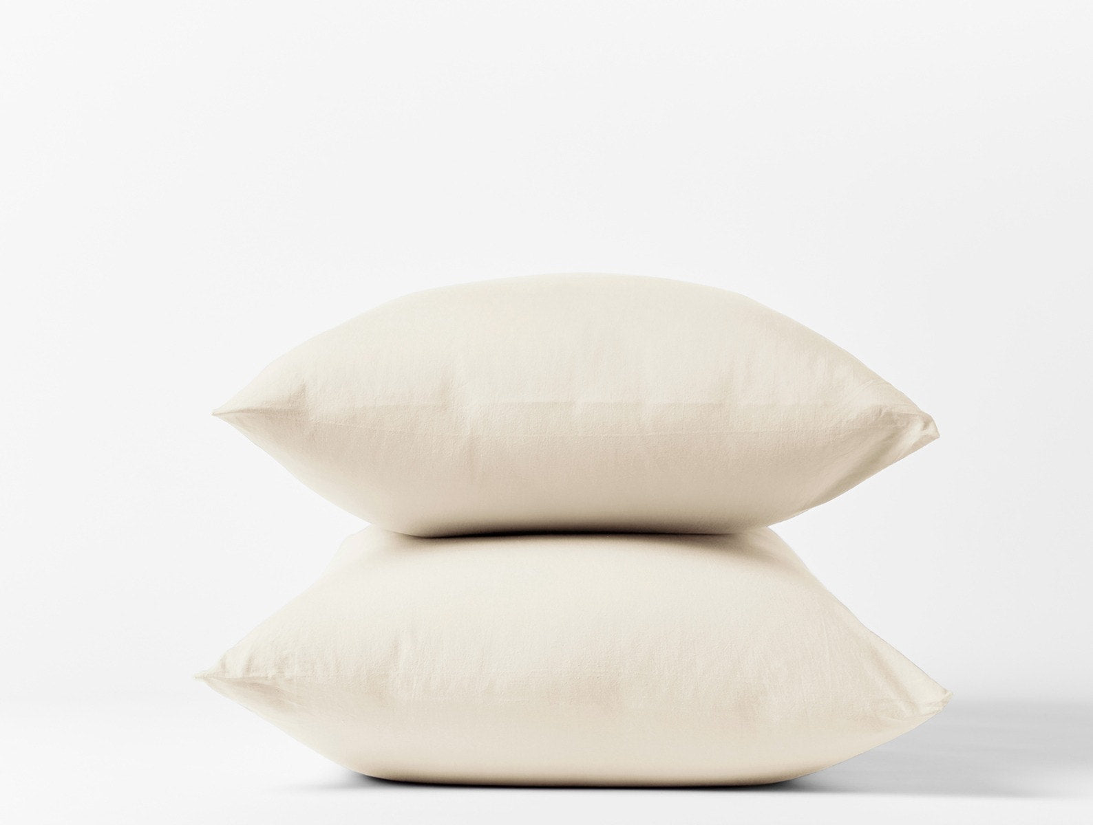 Coyuchi Crinkled Percale Pillowcase - stacked with white background #colour_Undyed
