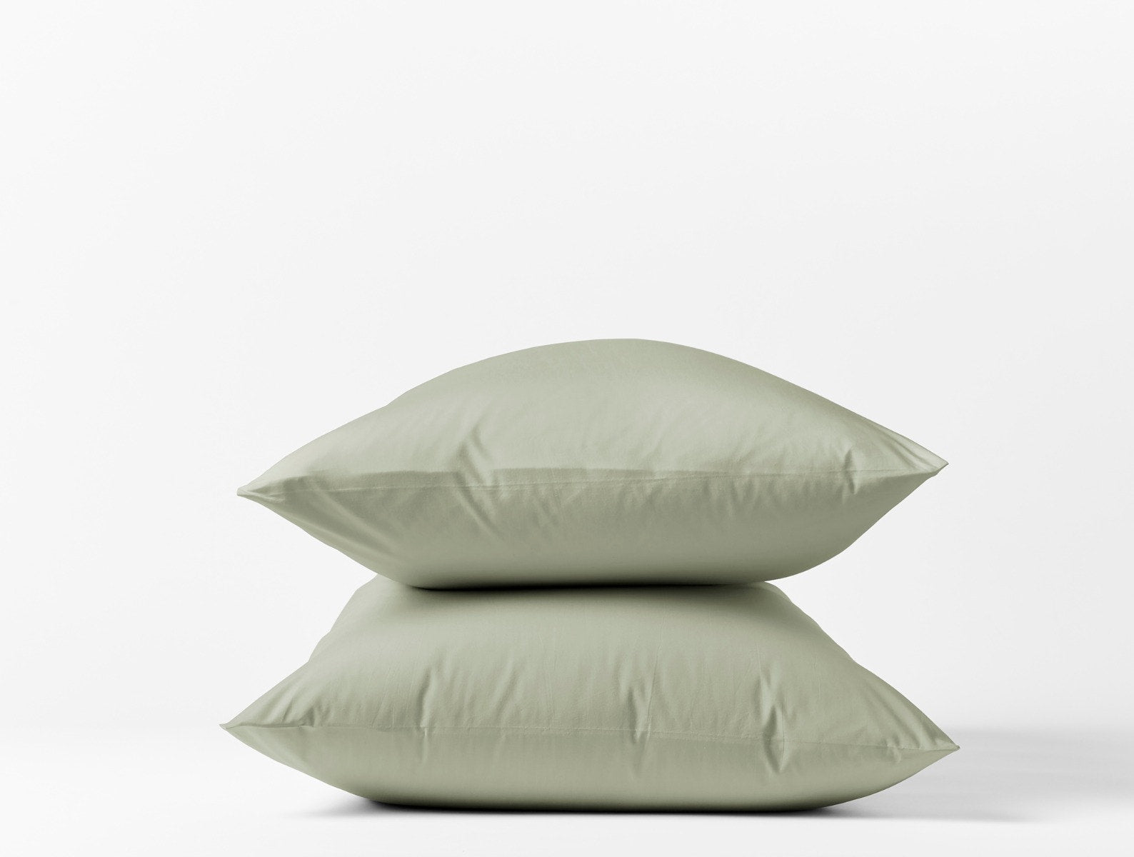 Coyuchi Organic Refined Percale Pillowcase - stacked with white background #colour_laurel