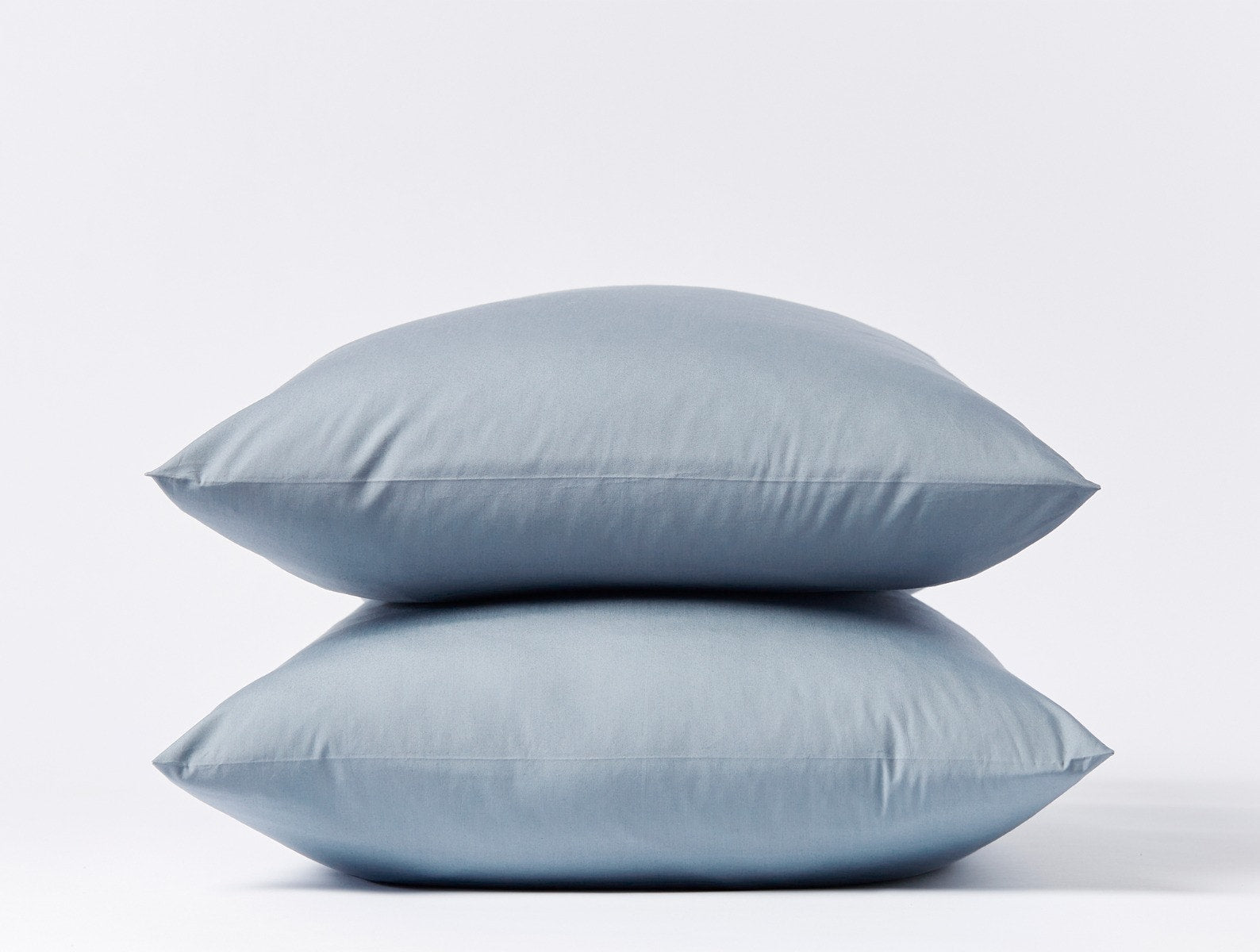 Coyuchi Organic Refined Percale Pillowcase - stacked with white background #colour_steel blue