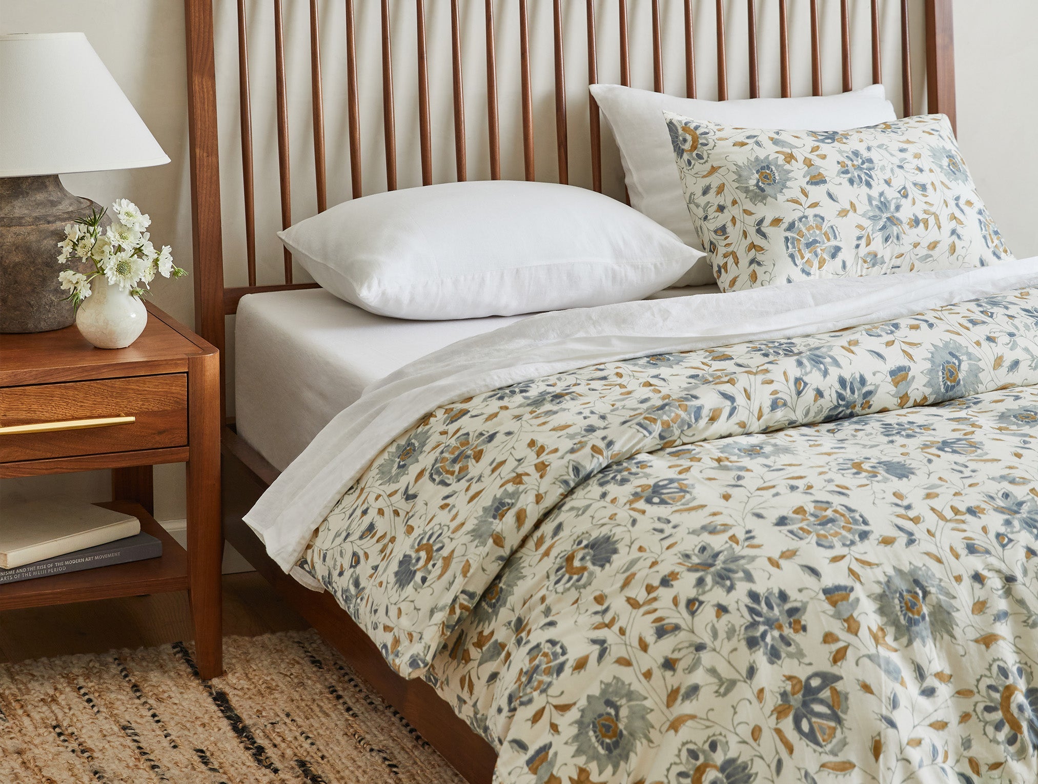 Coyuchi Organic Rejuvenation Flora Print
Duvet Cover - staged bed on wood frame #colour_undyed w/lagoon