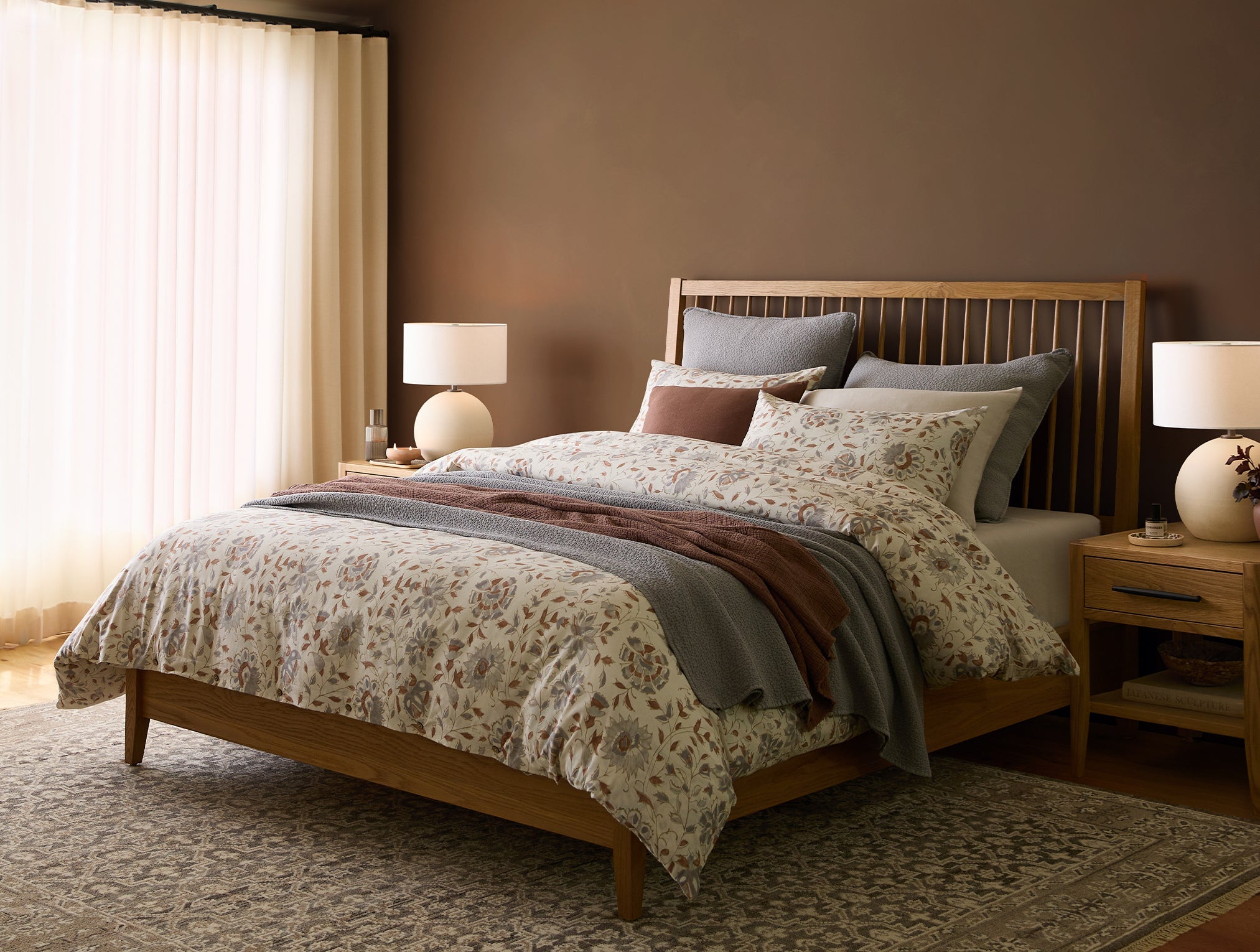 Coyuchi Organic Rejuvenation Flora Print Duvet Cover - staged bed in room with lamps #colour_undyed w/sedona