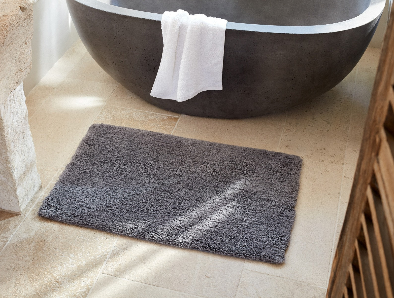 Coyuchi Organic Shag Bath Rug - on floor in front of bath tub #colour_slate