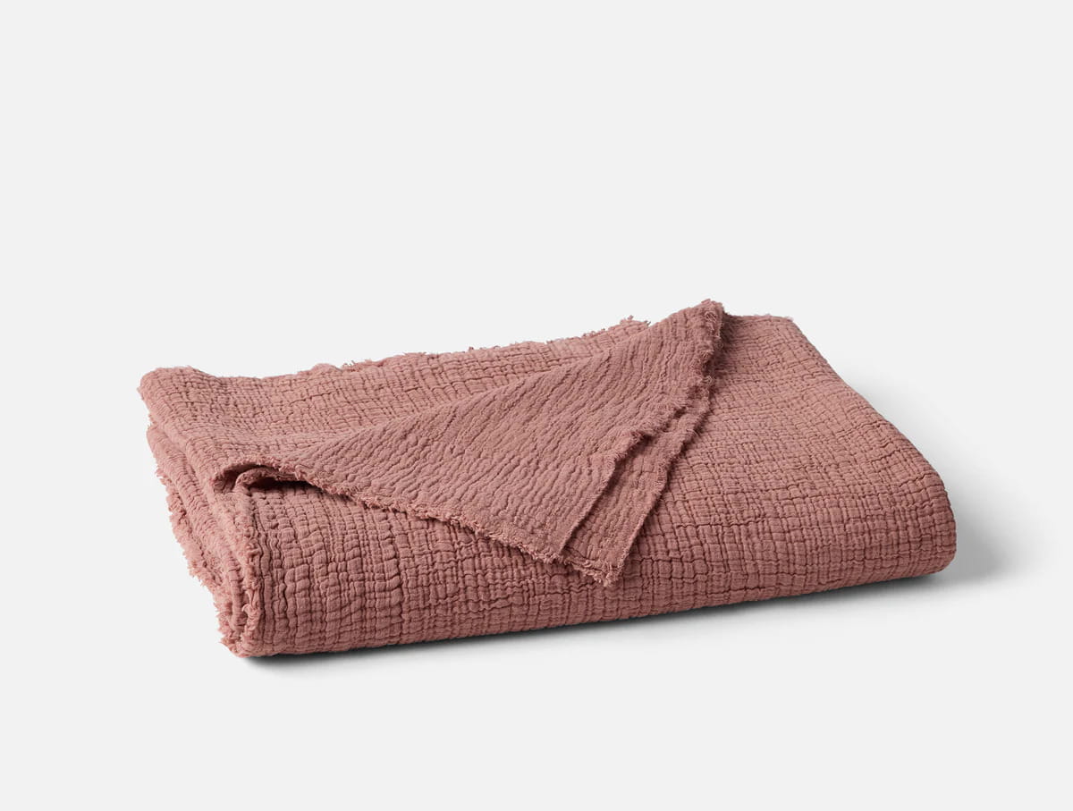 Coyuchi Organic Cotton Topanga Matelasse Blanket - folded #colour_plum blossom