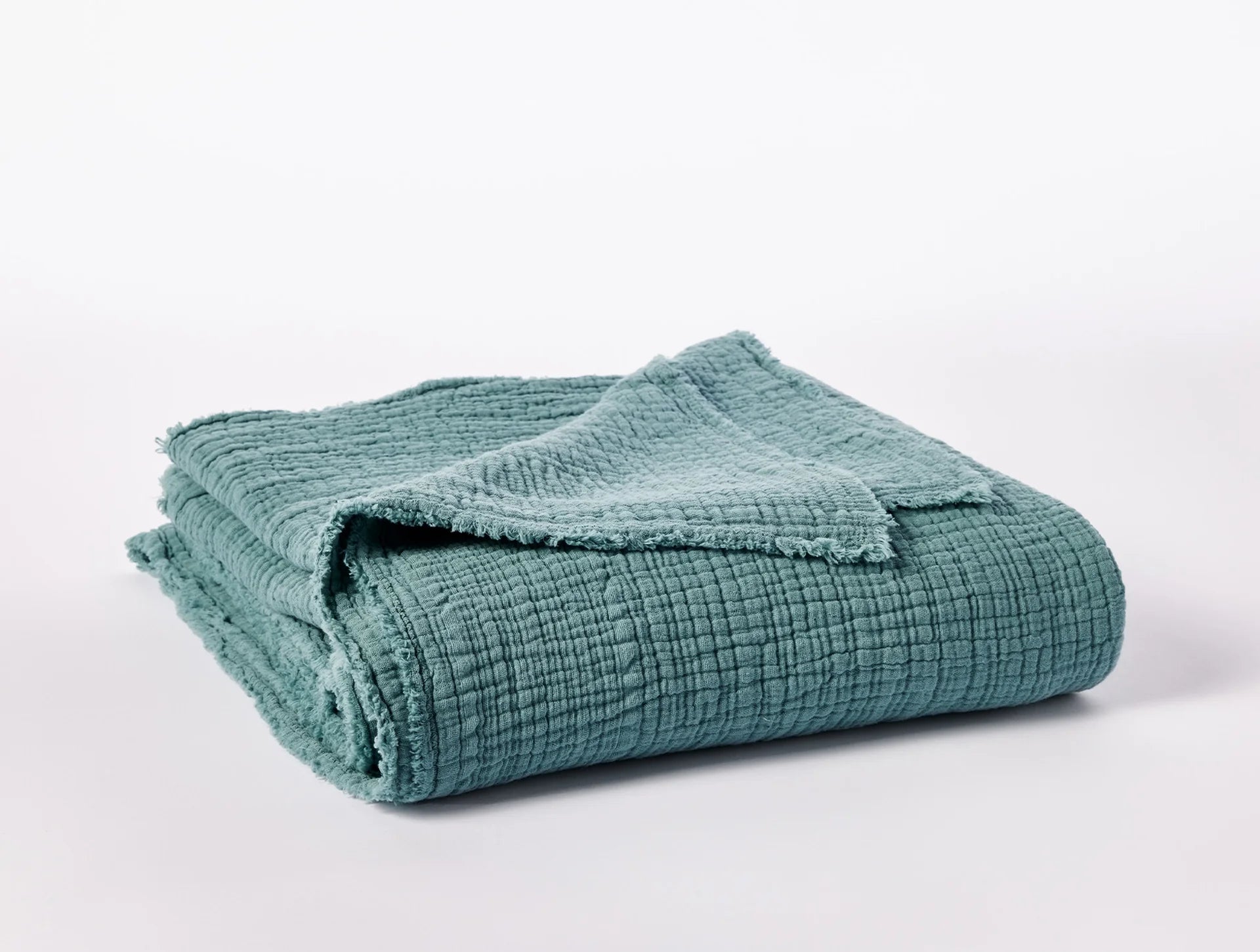 Coyuchi Topanga Organic Cotton Matelasse Throw - folded #colour_surf
