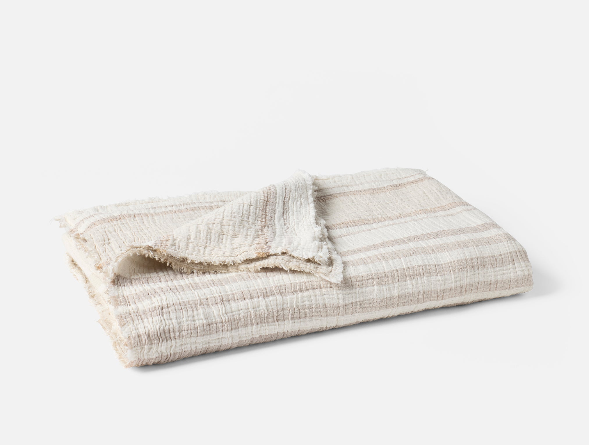 Coyuchi Topanga Organic Cotton Matelasse Throw - folded #colour_terra stripe