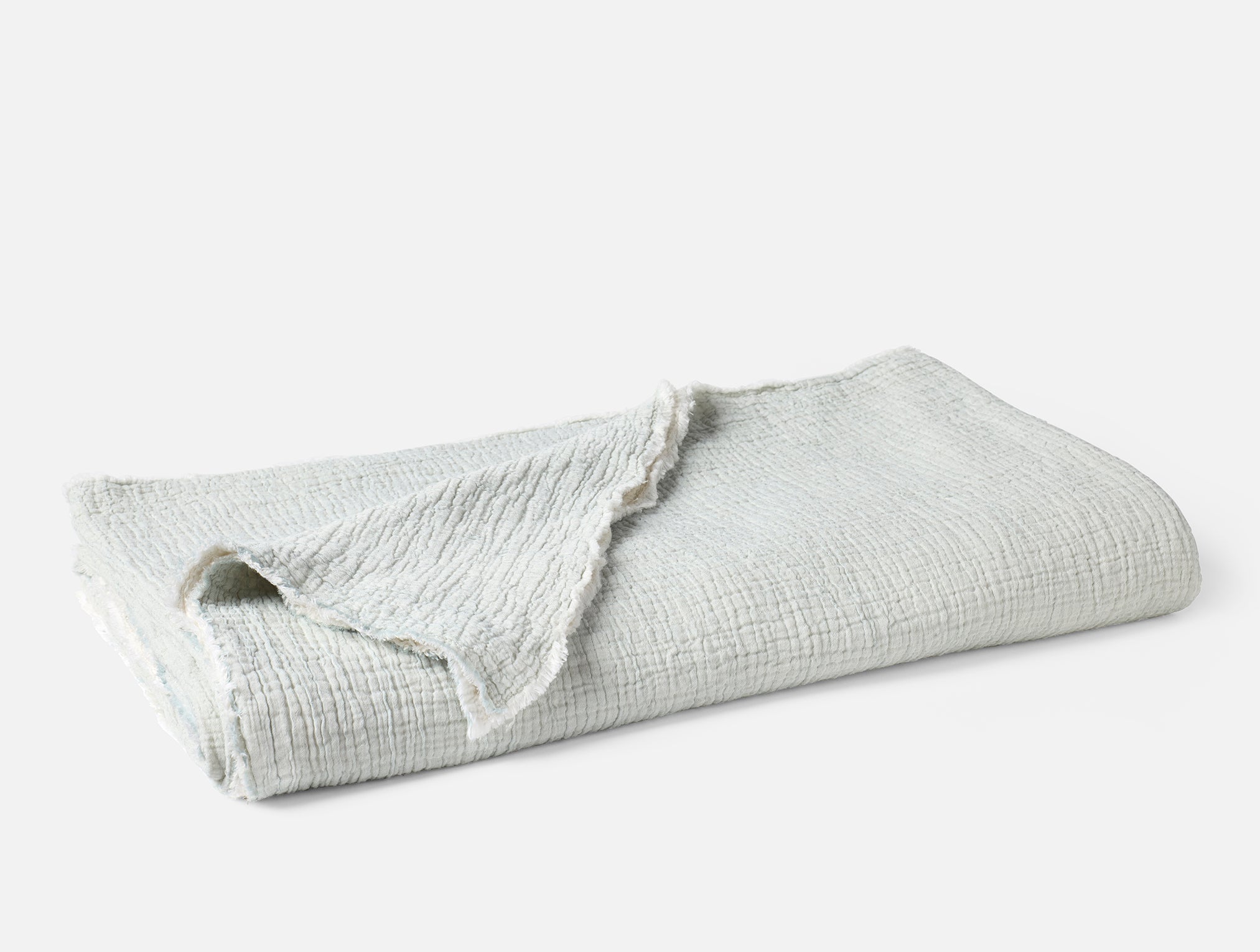 Coyuchi Topanga Organic Matelasse Blanket - folded #colour_tidal chambray