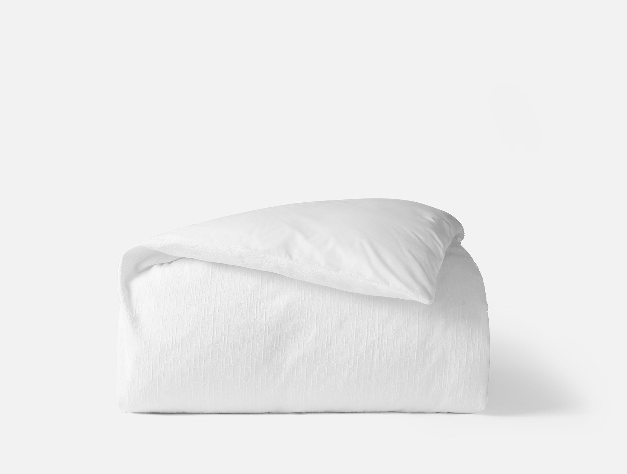 Coyuchi Toro Canyon Organic Duvet Cover - folded #colour_alpine white