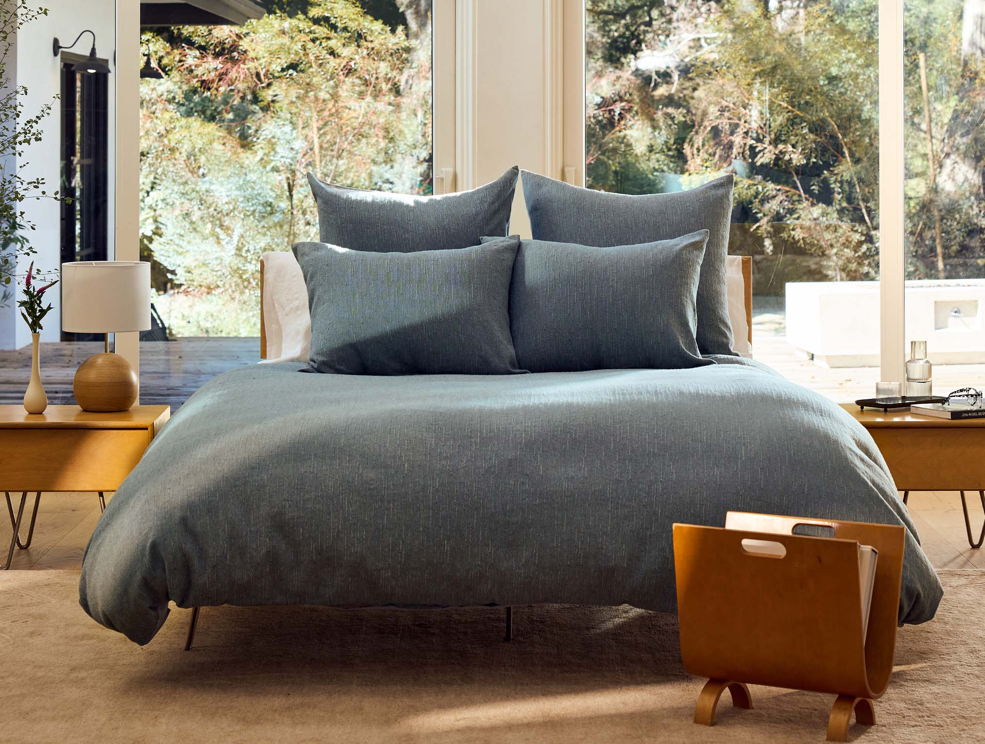 Coyuchi Toro Canyon Organic Duvet Cover - staged bed with large windows behind #Colour_marine