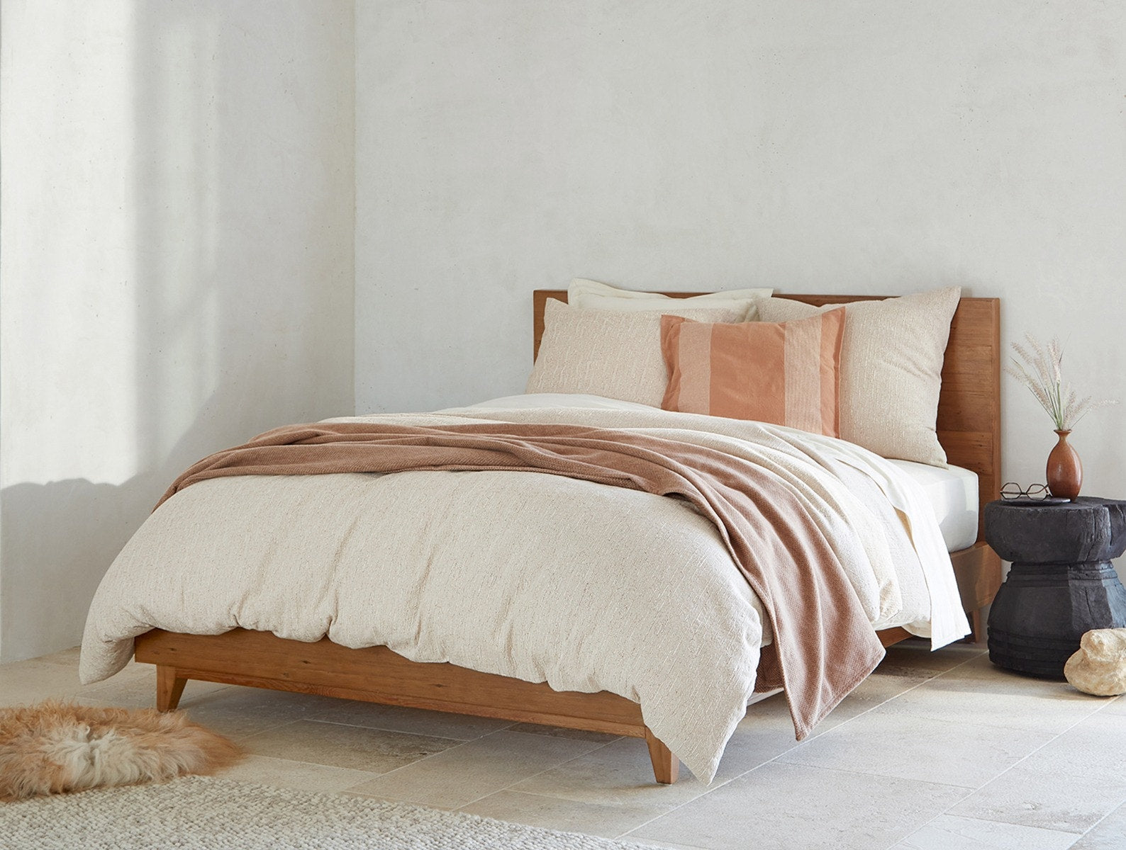 Coyuchi Toro Canyon Organic Duvet Cover - staged bed on wood frame #Color_nutmeg
