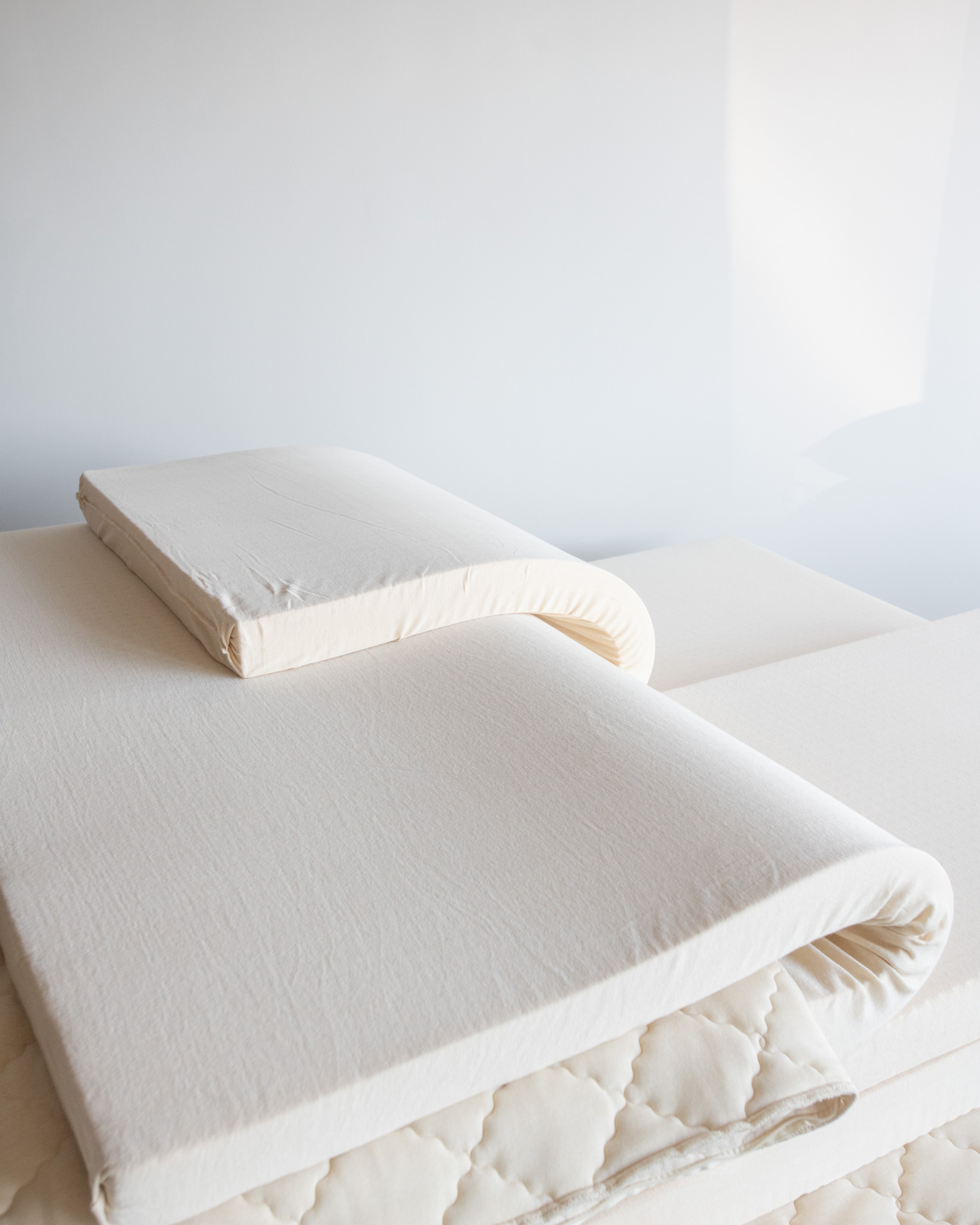 Inside of a resthouse organic mattress showing individual adjustable latex layers