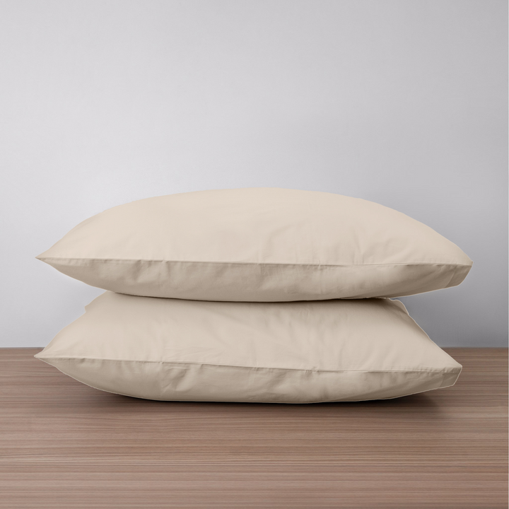 Homebird Organic Cotton Percale Pillowcases - on pillow #colour_sandy white