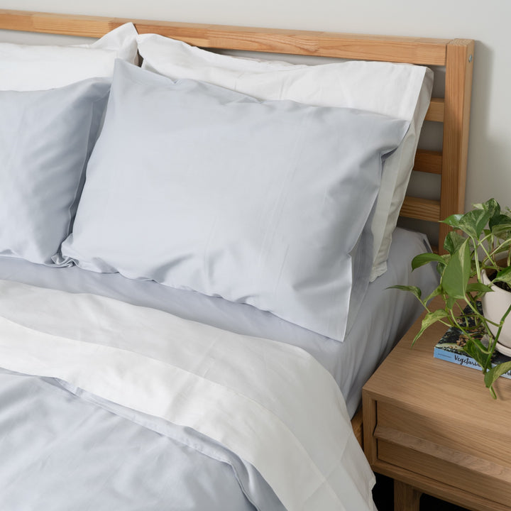 Homebird Organic Cotton Sateen Duvet Cover and Pillowcases - staged bed #colour_blue