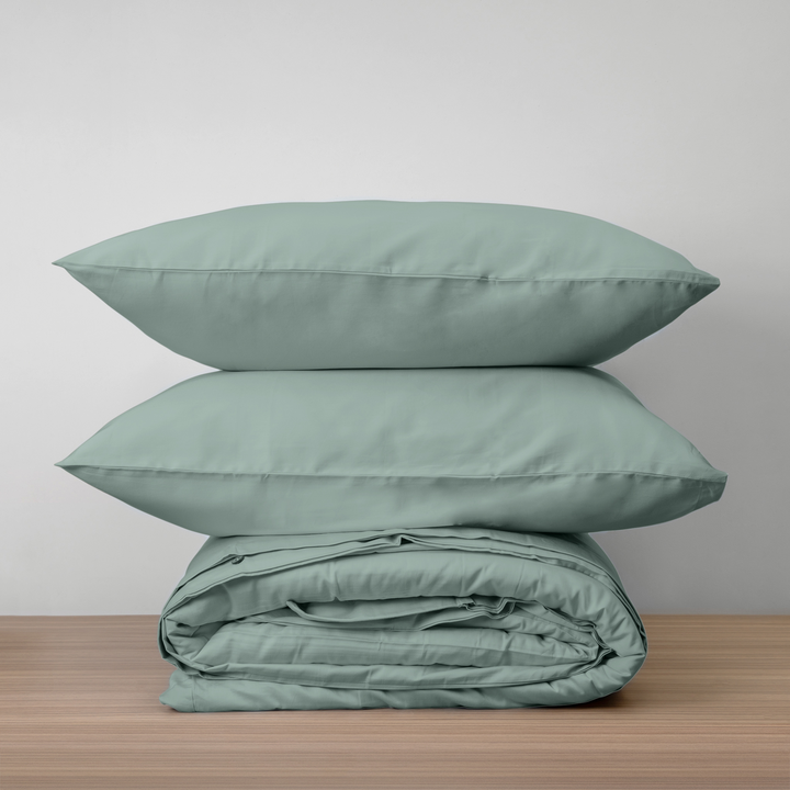 Homebird Organic Cotton Sateen Duvet Cover and Pillowcases - stacked duvet cover with pillows #colour_green