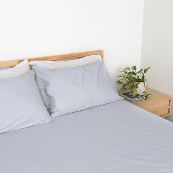 Homebird Organic Cotton Sateen Fitted Sheet and Pilllowcase - staged bed #colour_blue