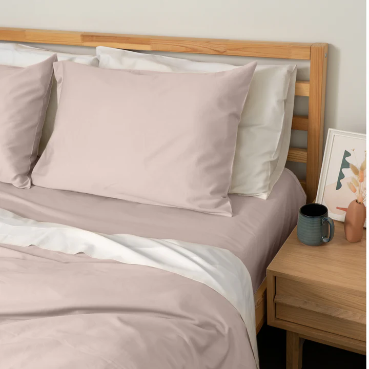 Homebird Organic Cotton Sateen Fitted Sheet and Pillowcase - staged bed #colour_blush