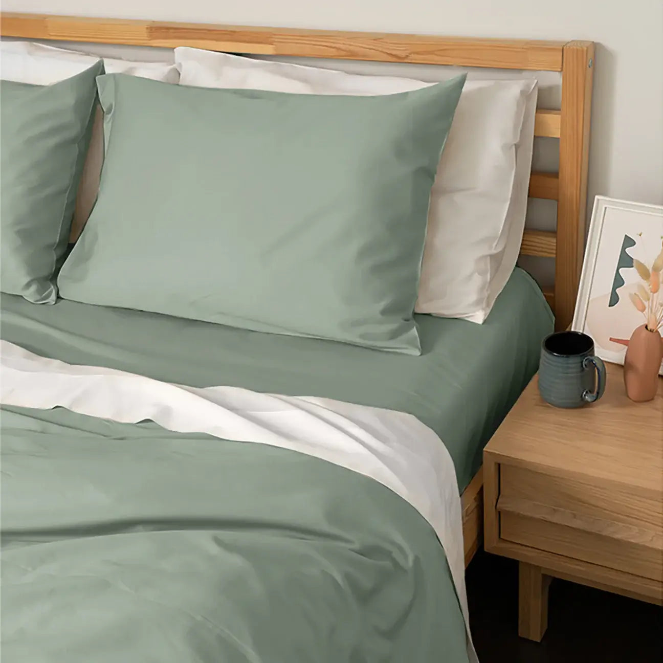 Homebird Organic Cotton Sateen Fitted Sheet and Pillowcase - staged bed #colour_green