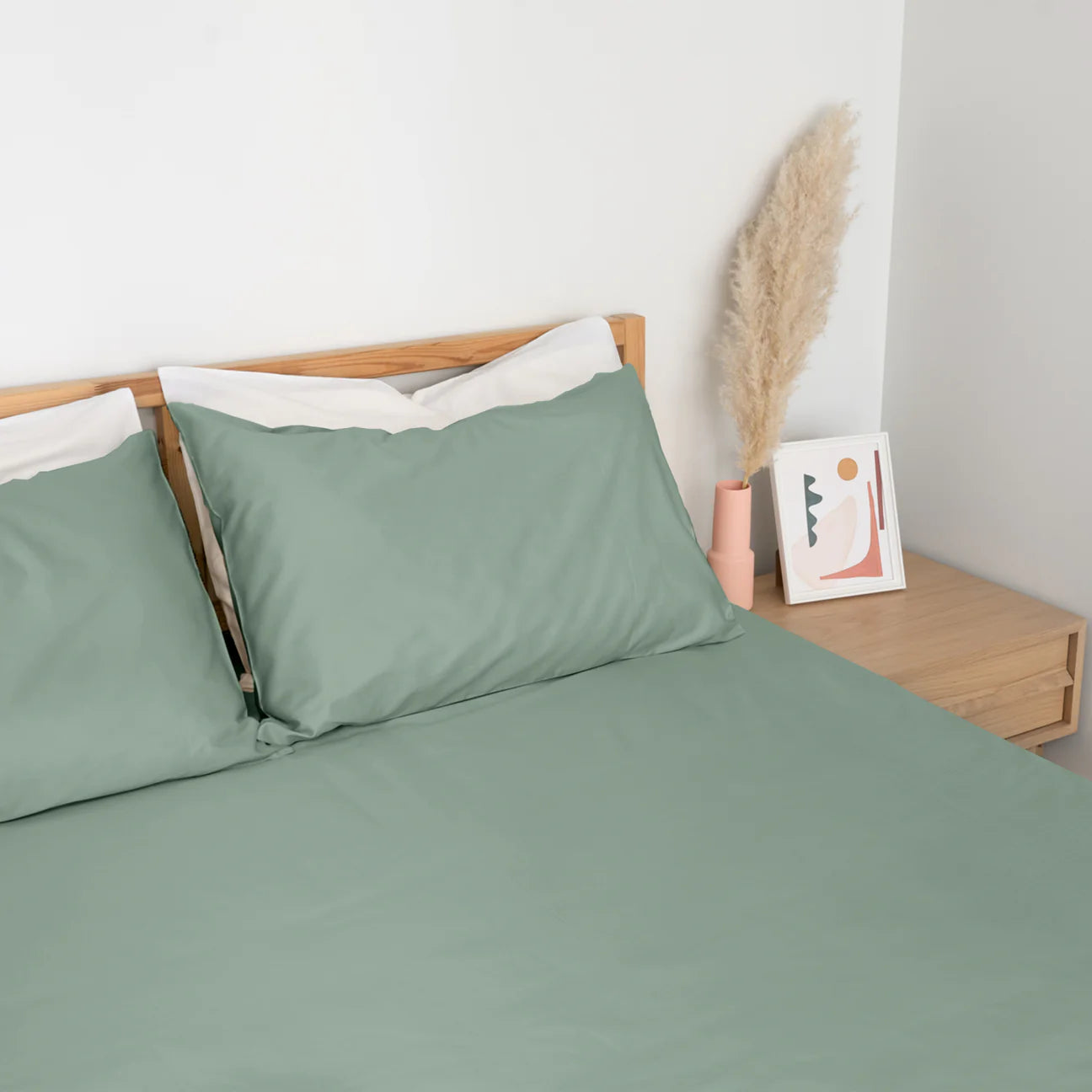 Homebird Organic Percale Fitted Sheet and Pillowcases - staged bed #colour_sage green