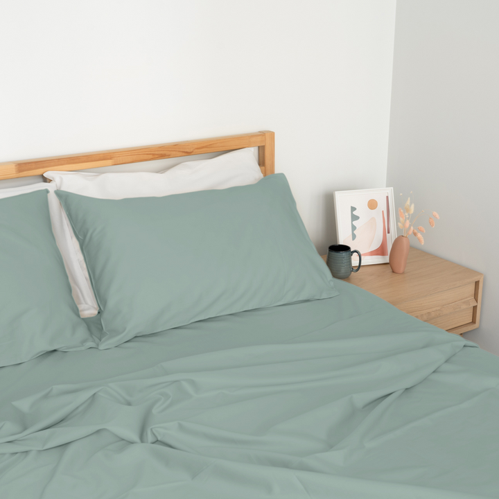 Homebird Organic Sateen Flat Sheet - staged bed #colour_green