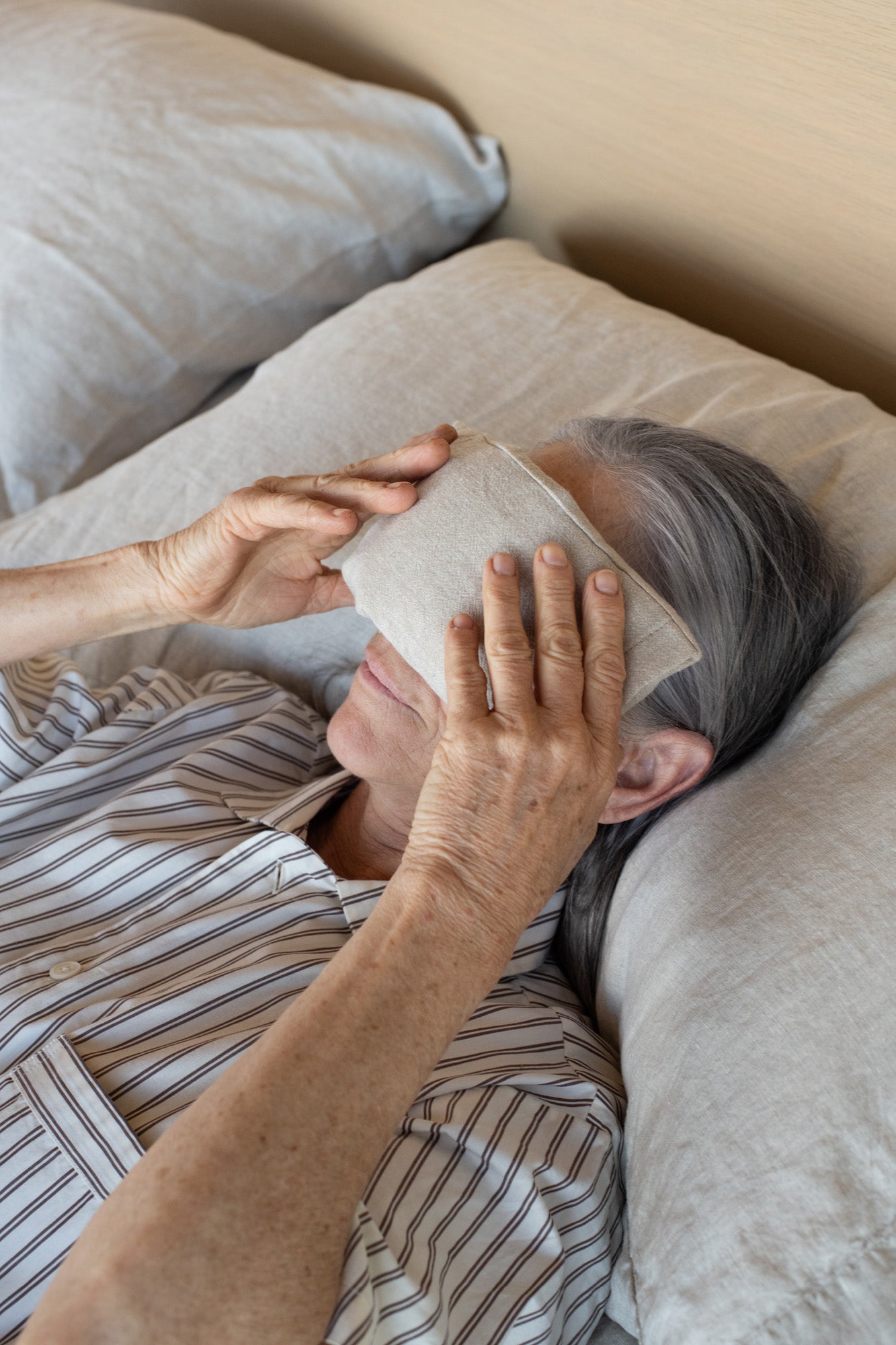 Kakun Eye Pillow - model resting pillow over eyes