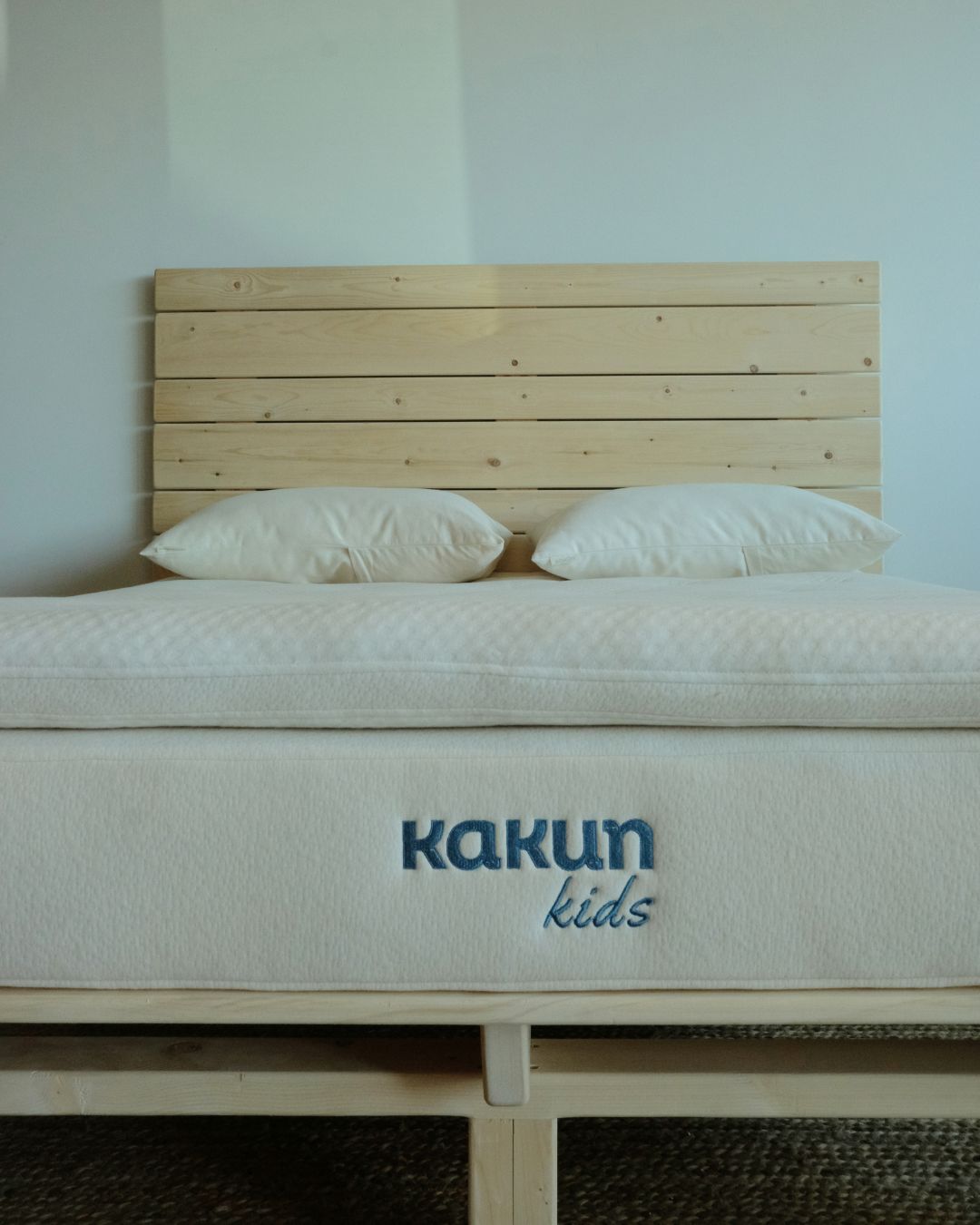 Kakun Organic Latex Kids Mattress with Organic Luxury Topper - close up of bottom of mattress on Magic Platform Bed Frame