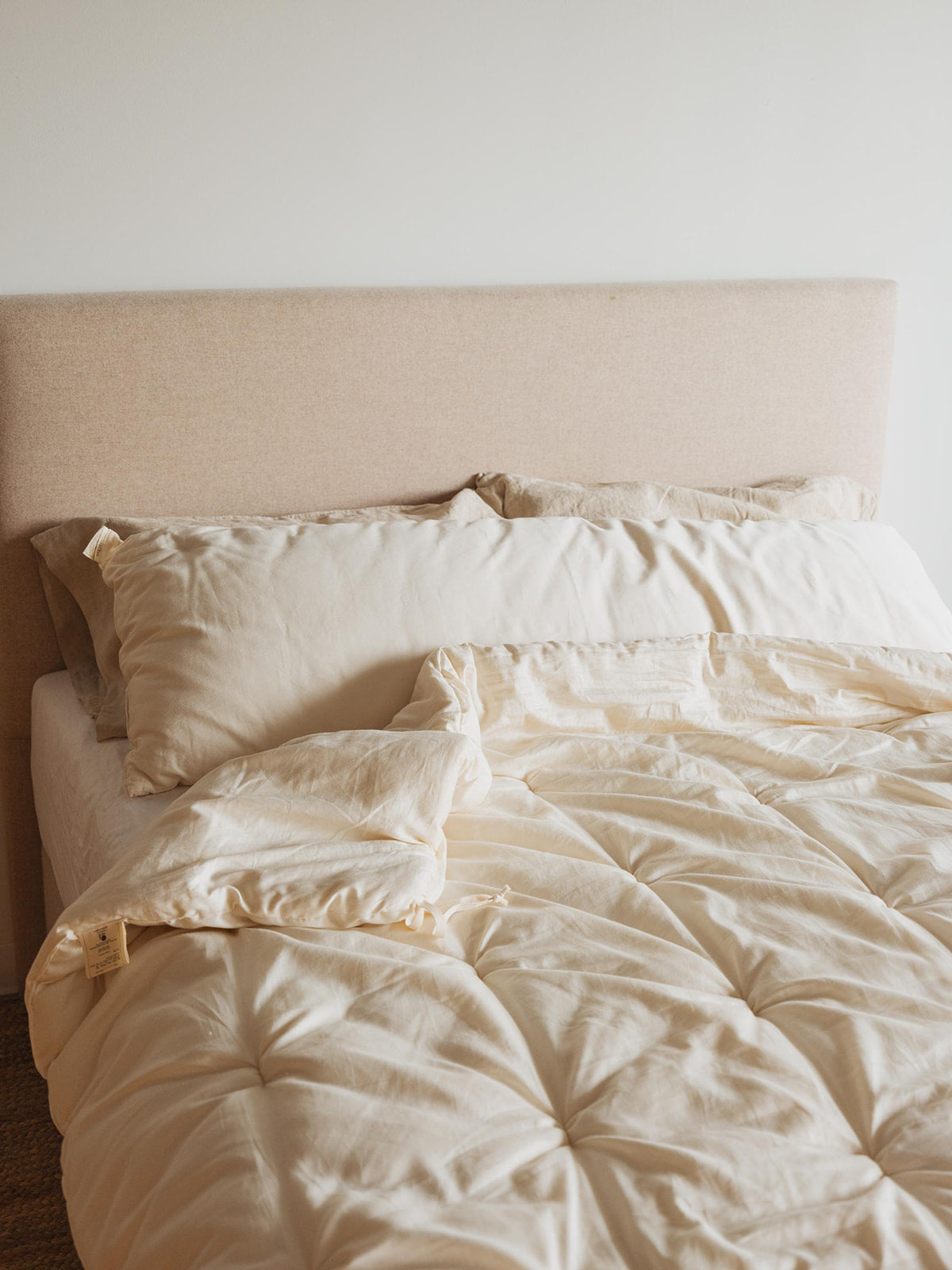 Kakun Luxury Wool Comforter - made bed with corner of comforter folded back