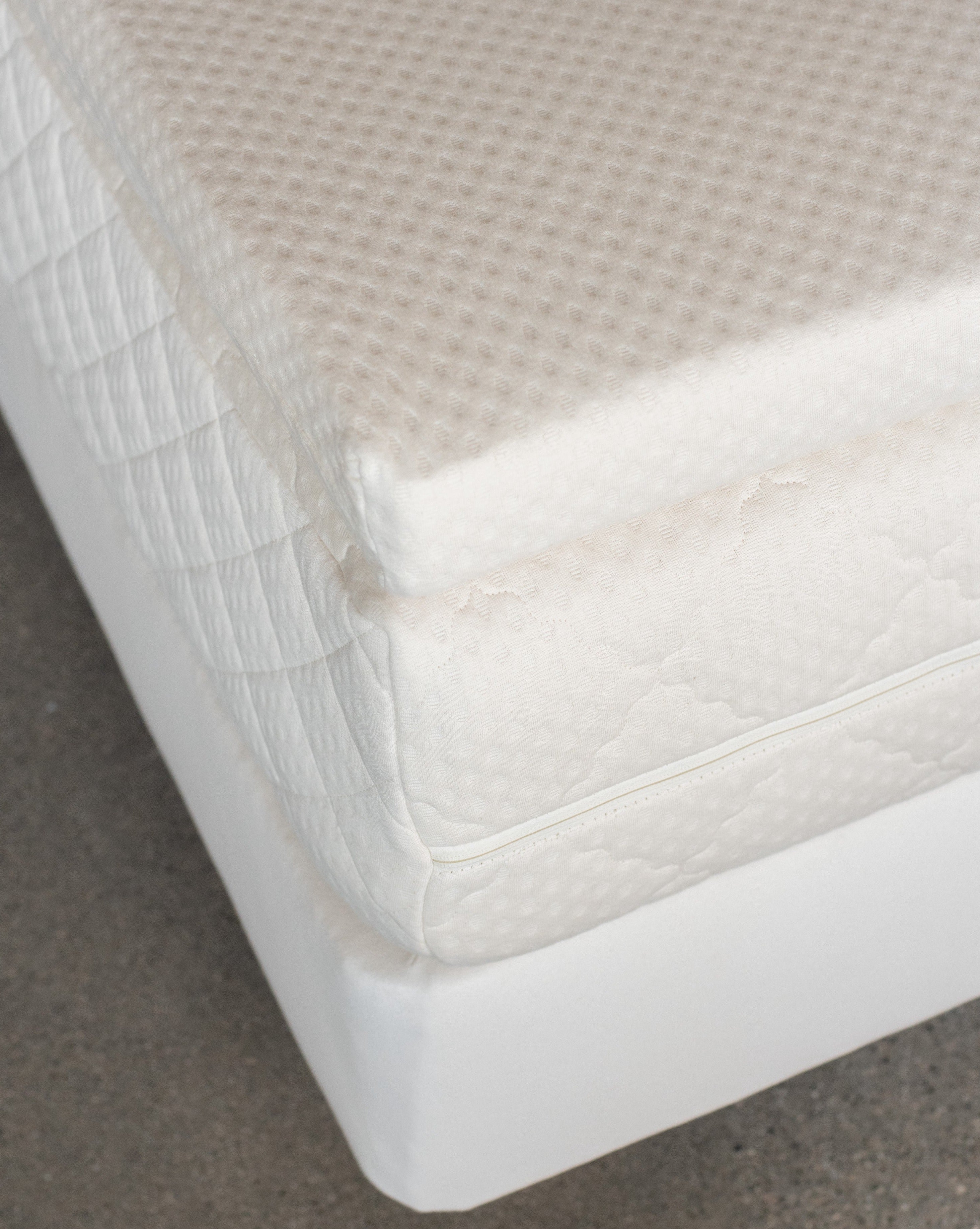 Kakun Organic Latex Mattress Topper - showing corner of topper on mattress